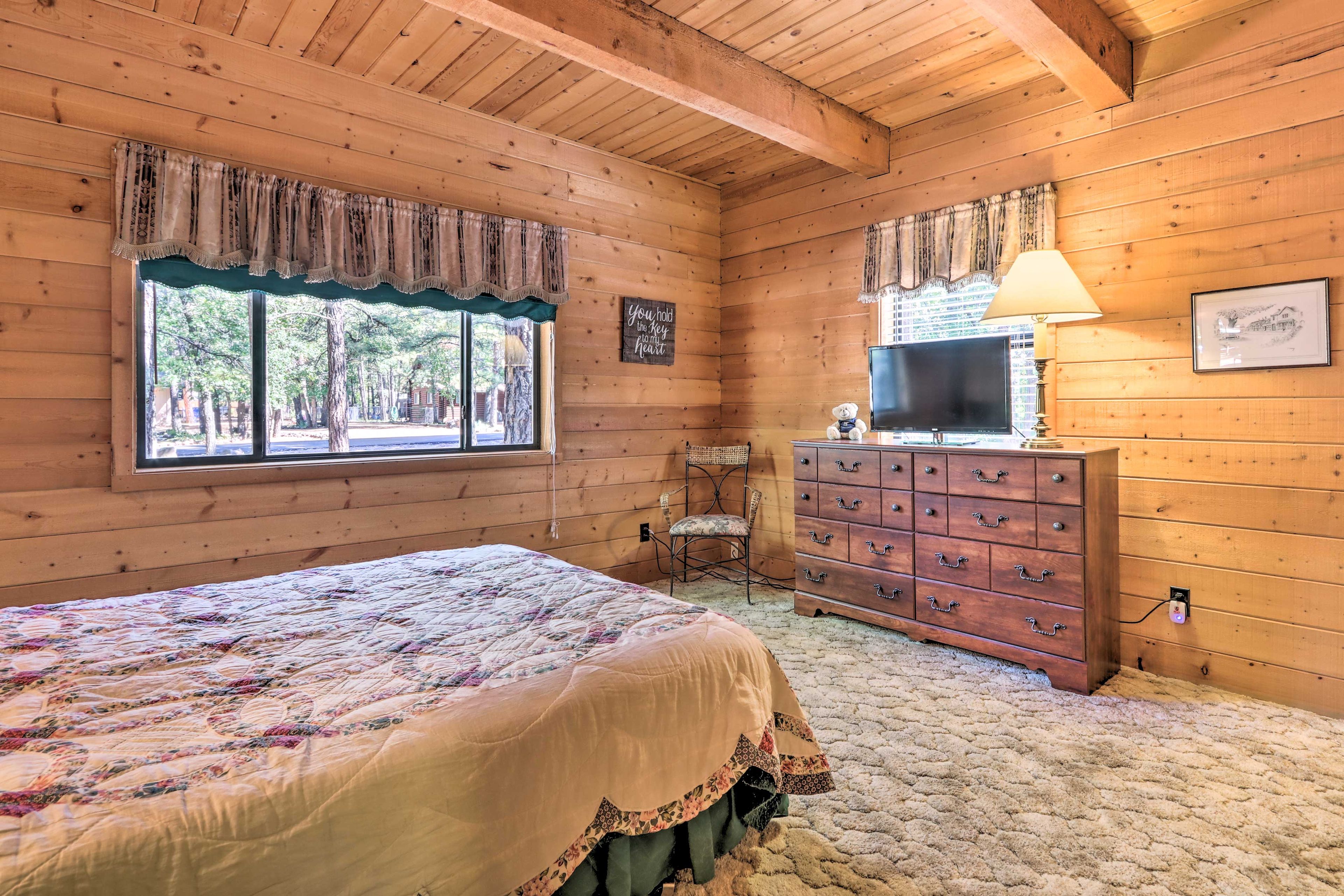 The bedroom suite is complete with a queen-sized bed for 2.