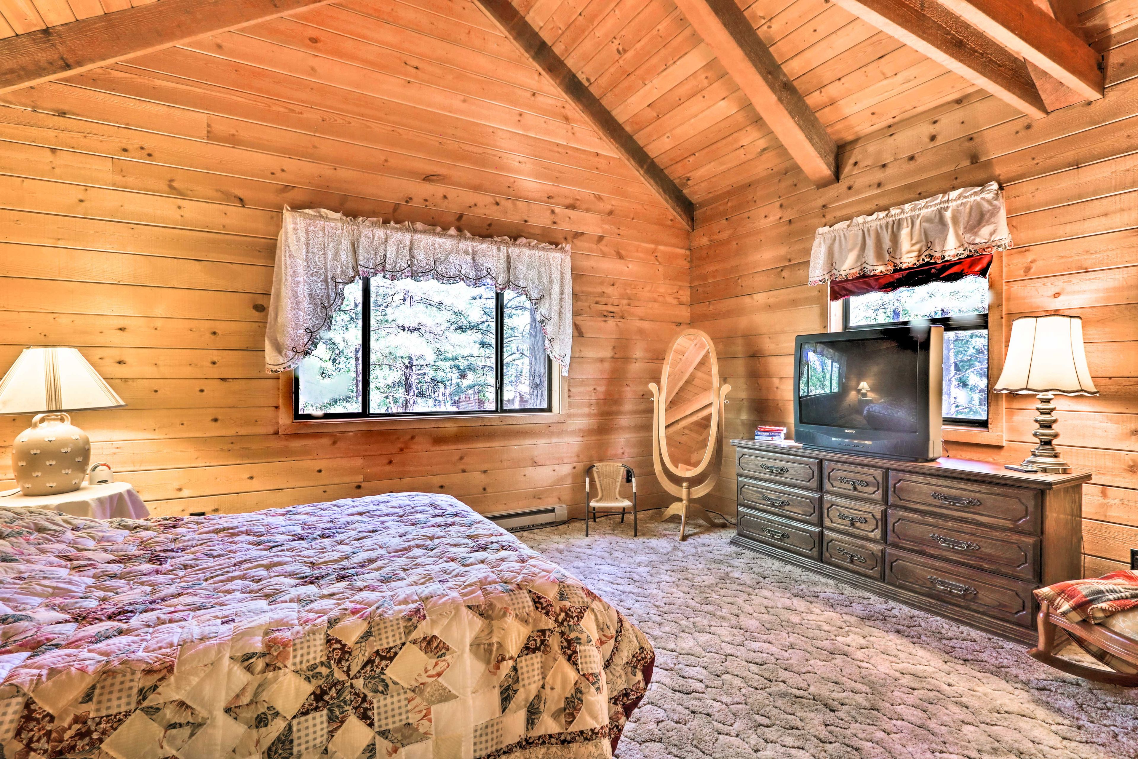 The third bedroom boasts a queen bed and vaulted ceilings.
