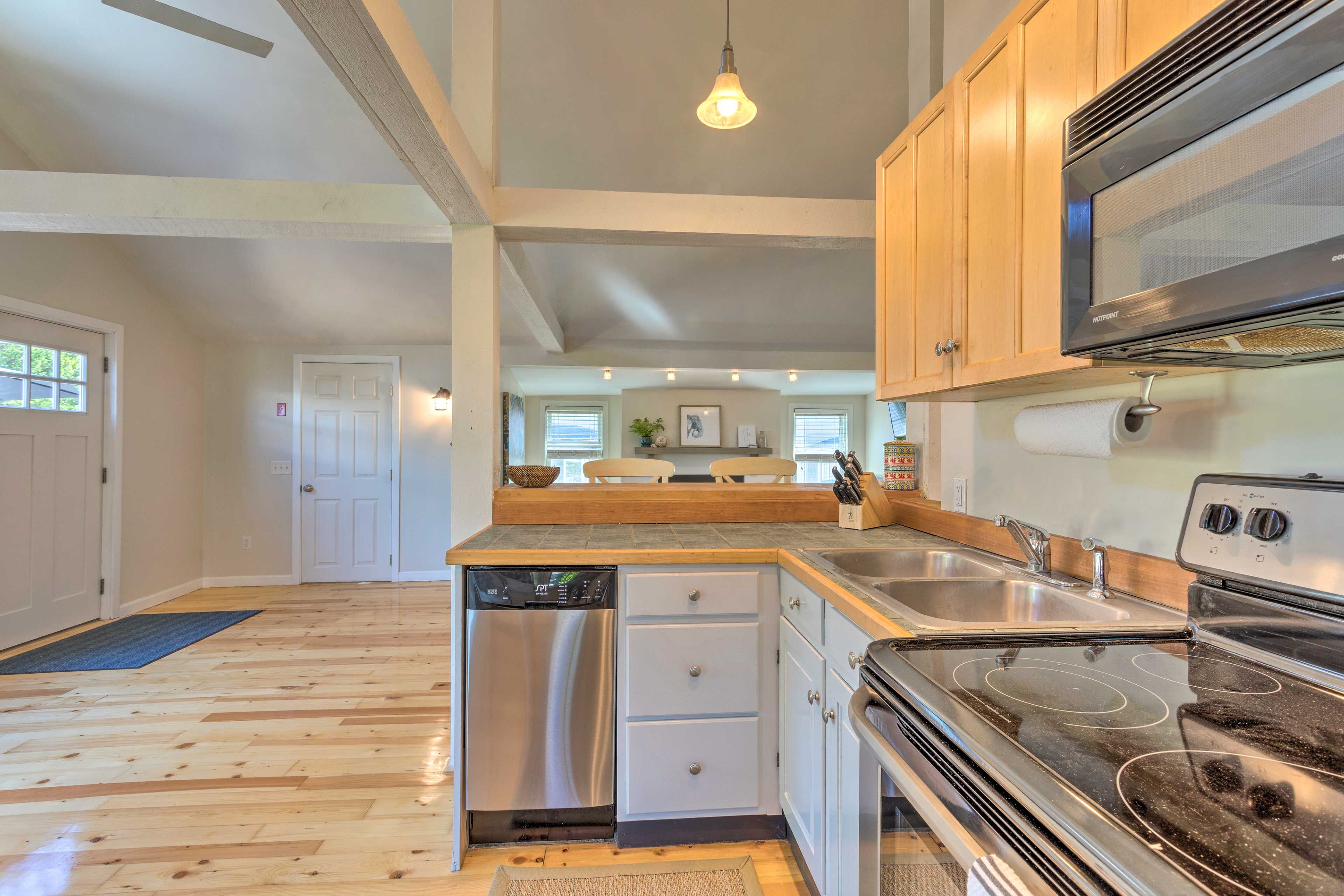 The kitchen is fully equipped with stainless steel appliances.