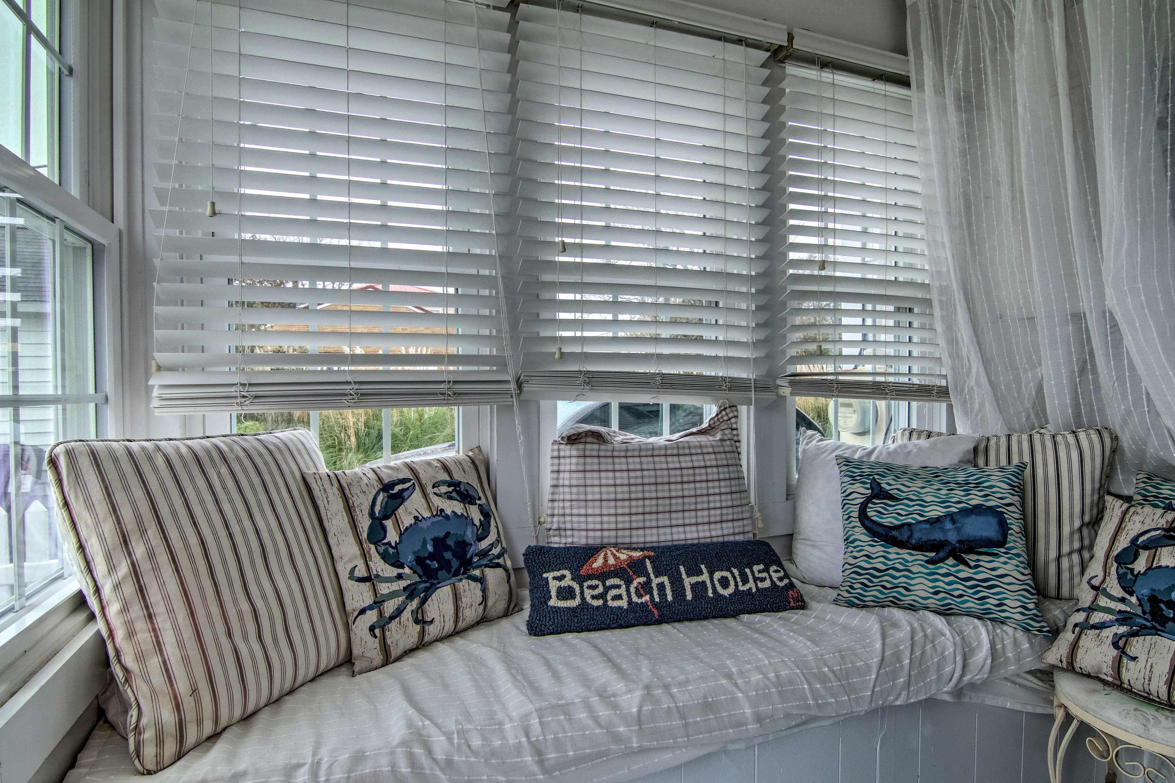 For a little quiet time, cozy up in the reading nook off the sunroom.