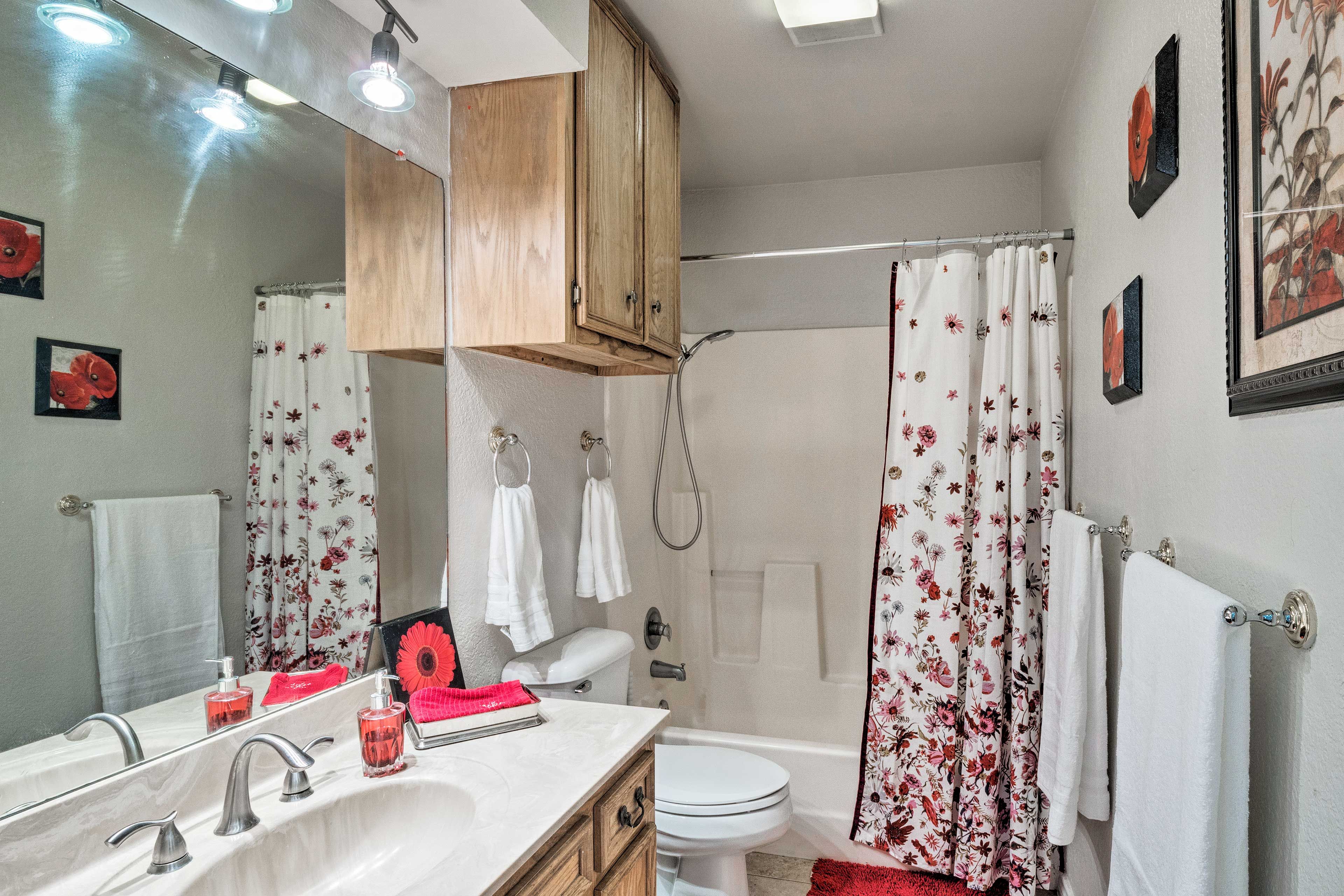 The bathroom features a shower/tub combo.