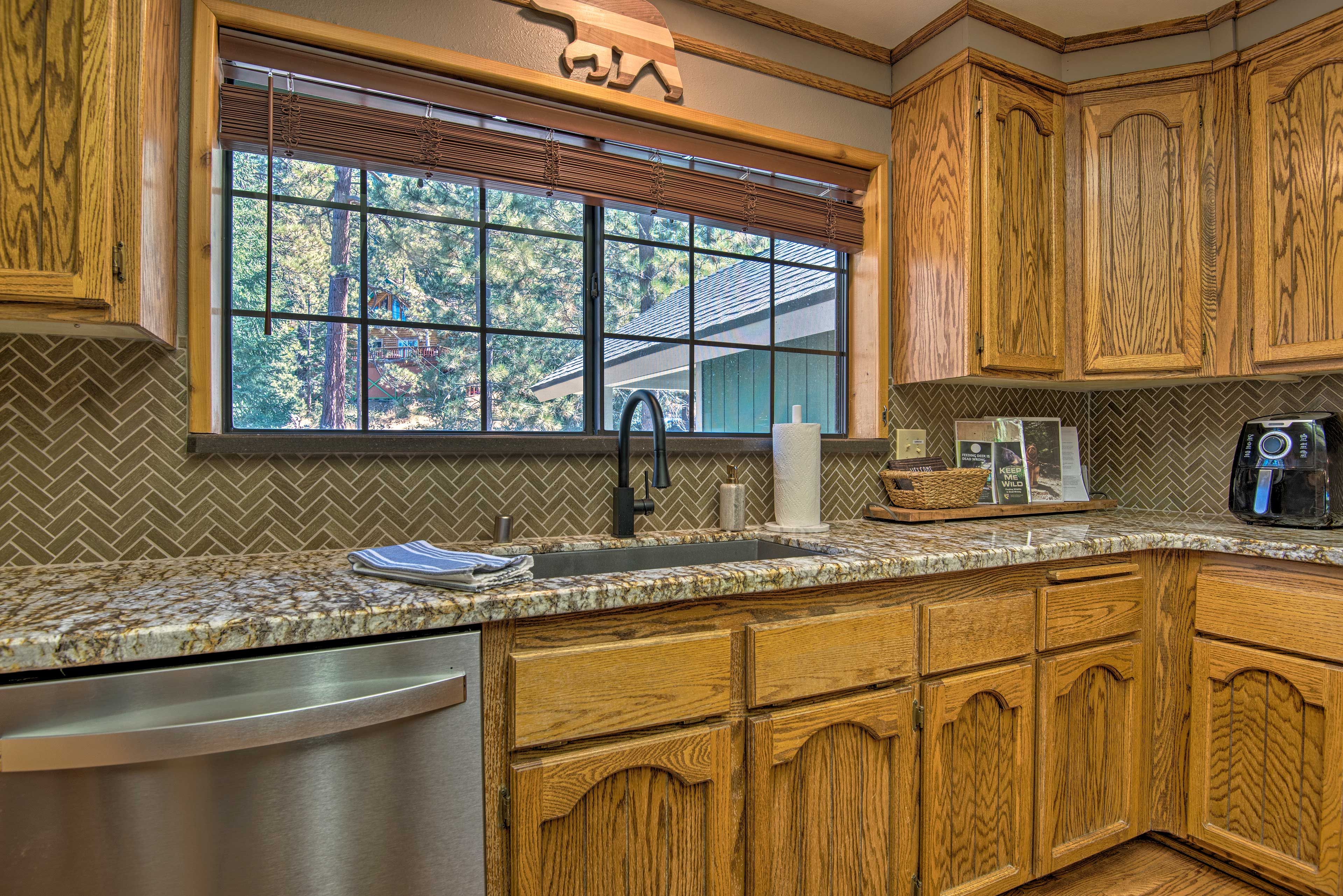 The kitchen is fully equipped with basic cooking needs.