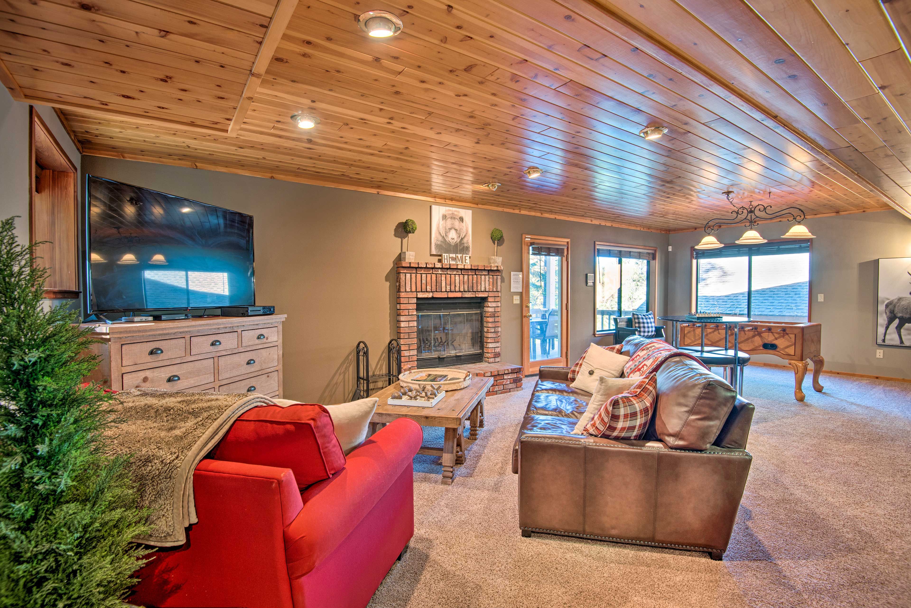 The second living area boasts a large flat-screen TV and seating.