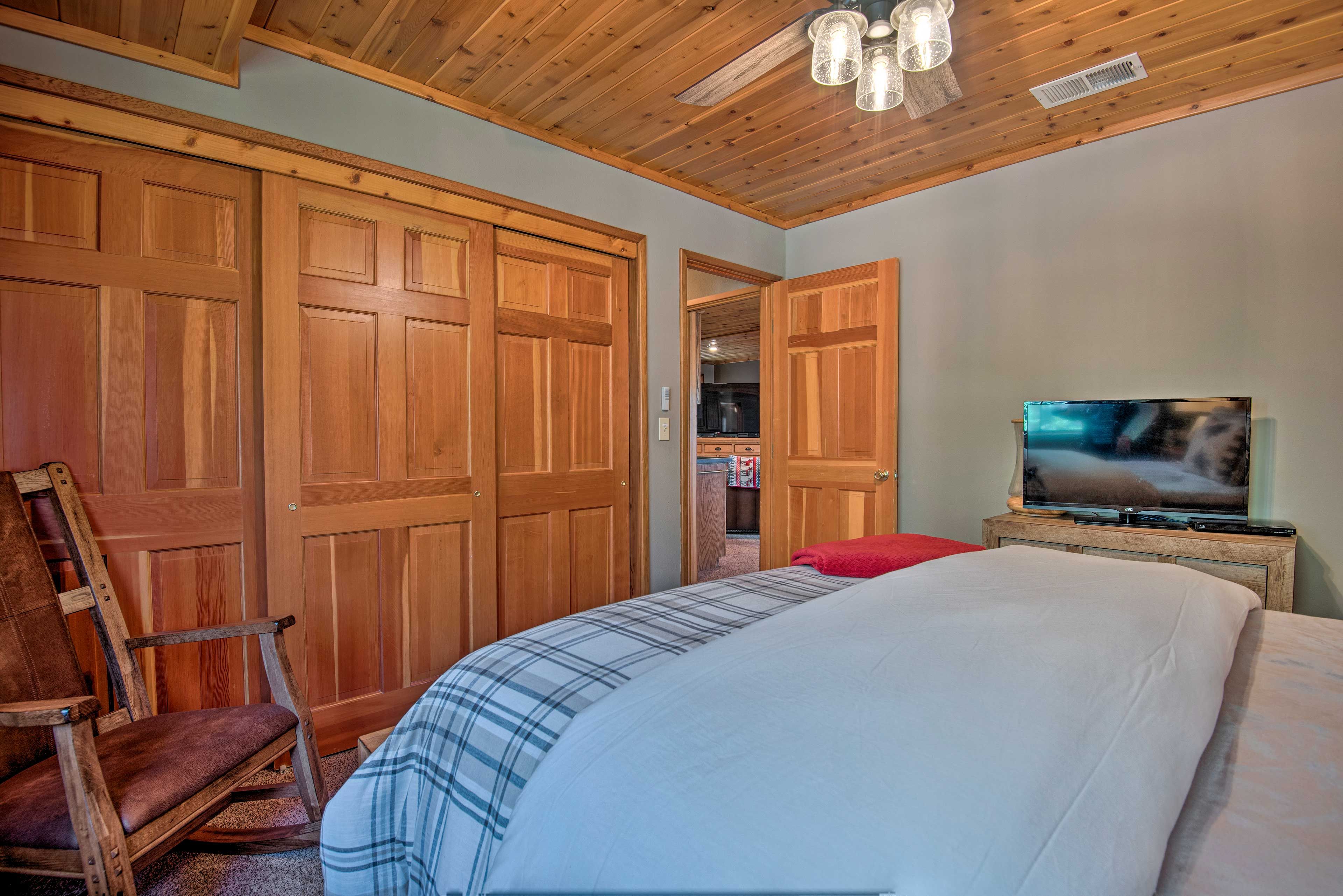 The master bedroom is complete with a flat-screen TV and spacious closet.