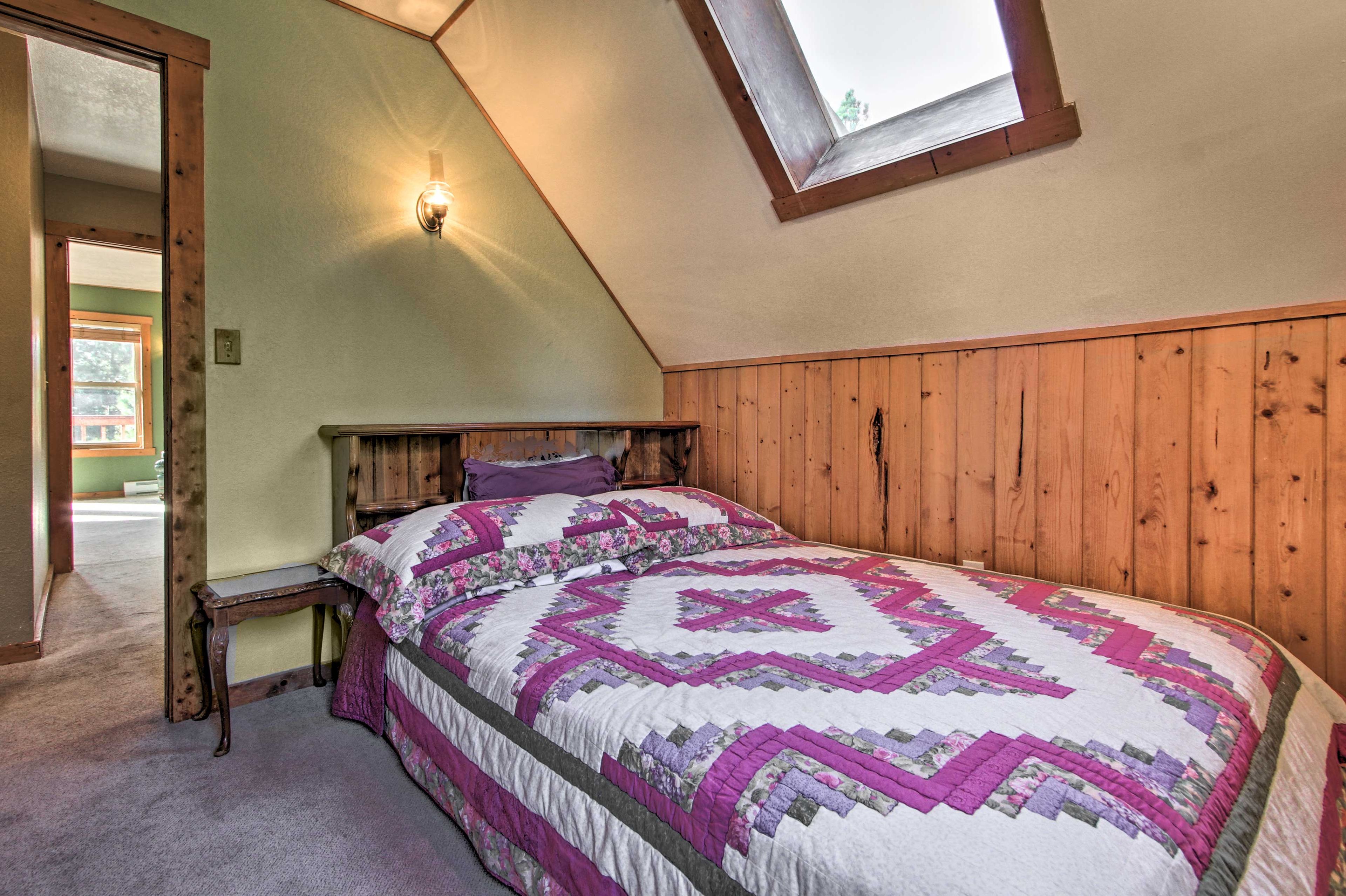 A queen bed furnishes this cozy room.