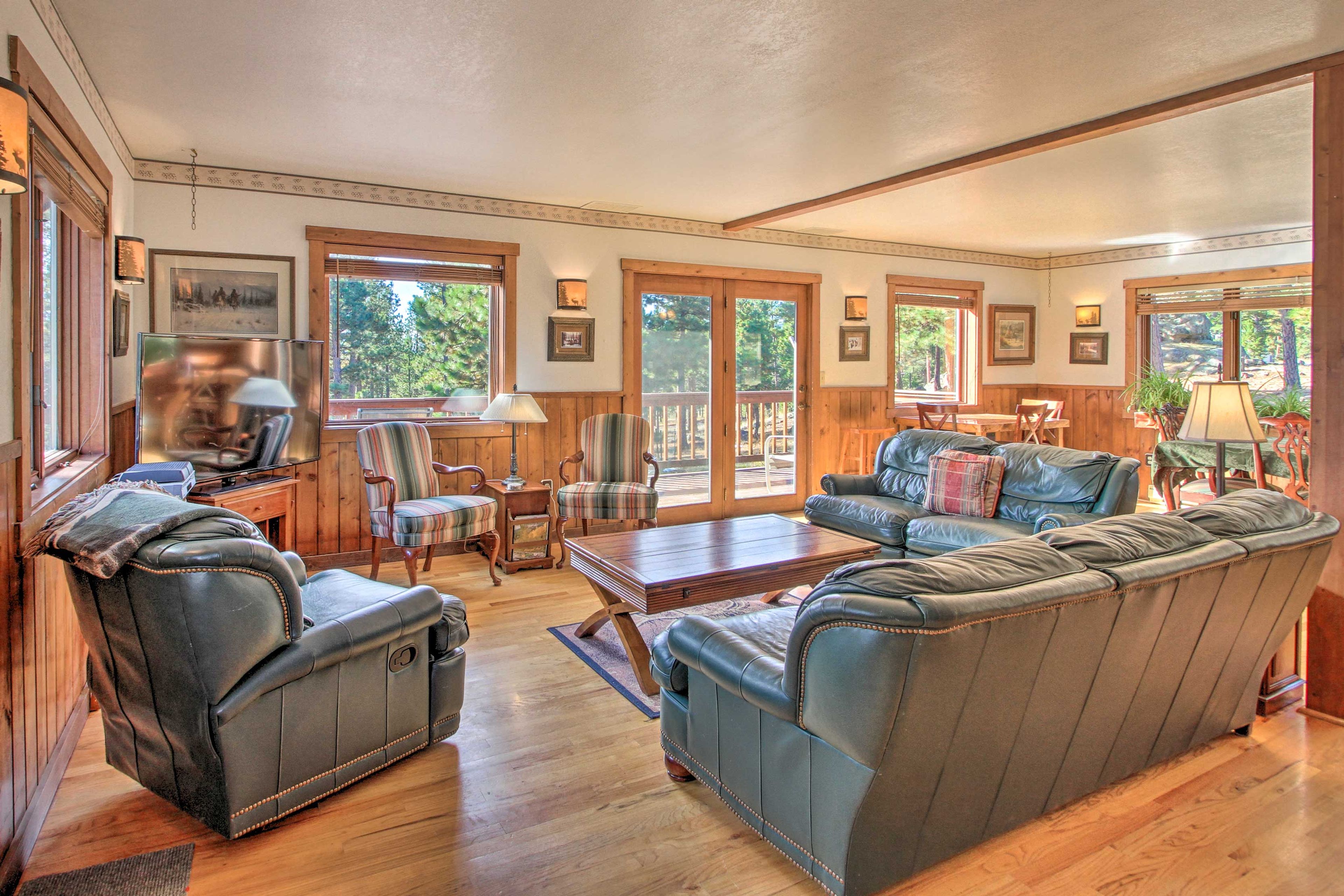 Upstairs, hardwood floors reflect the sunlight pouring in.