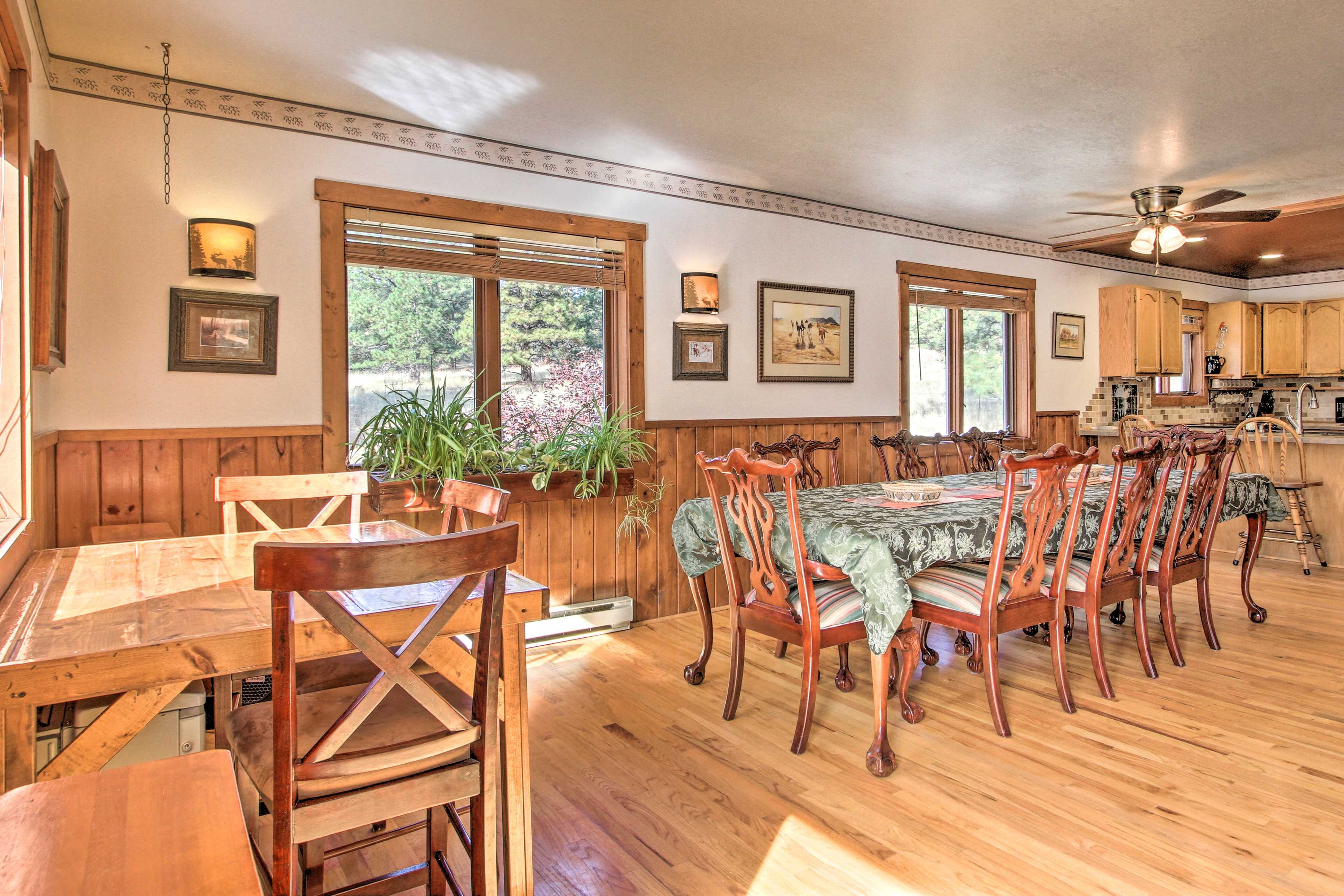 The expansive living area also boasts seating for everyone at 2 tables.