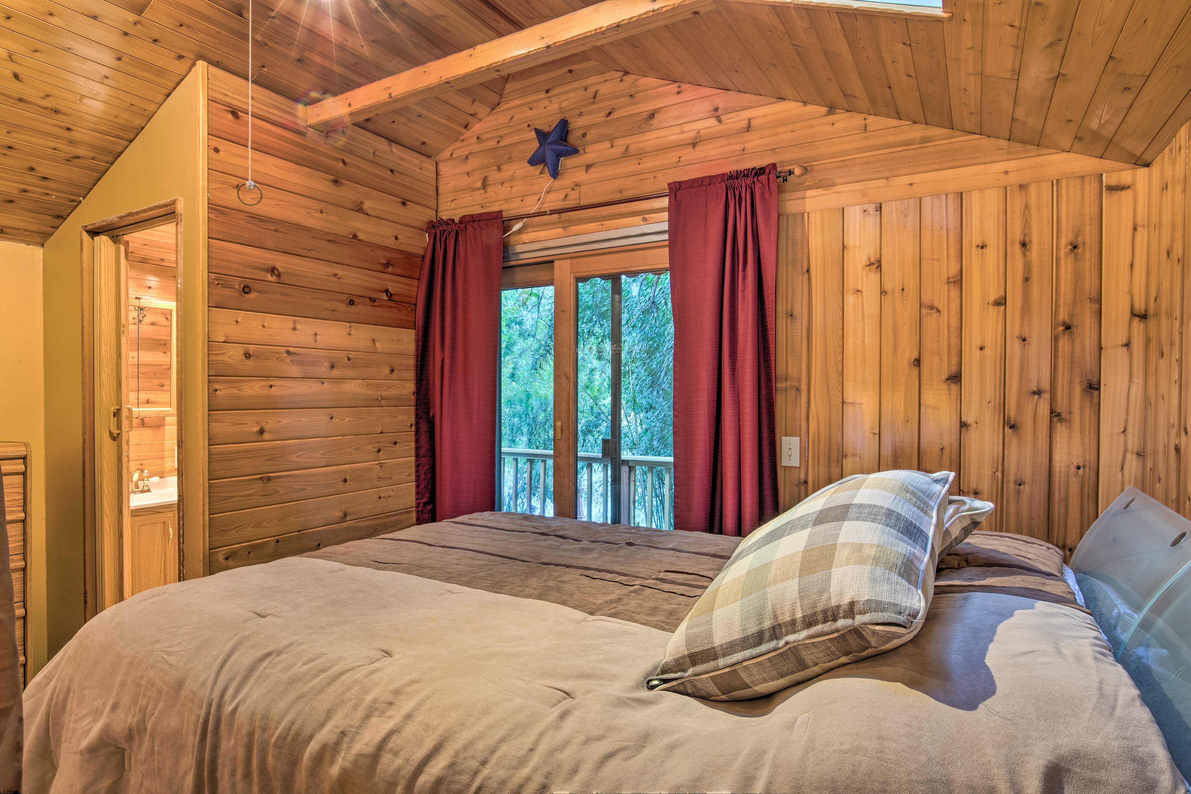 Wake up with views of the woods that surround this home.