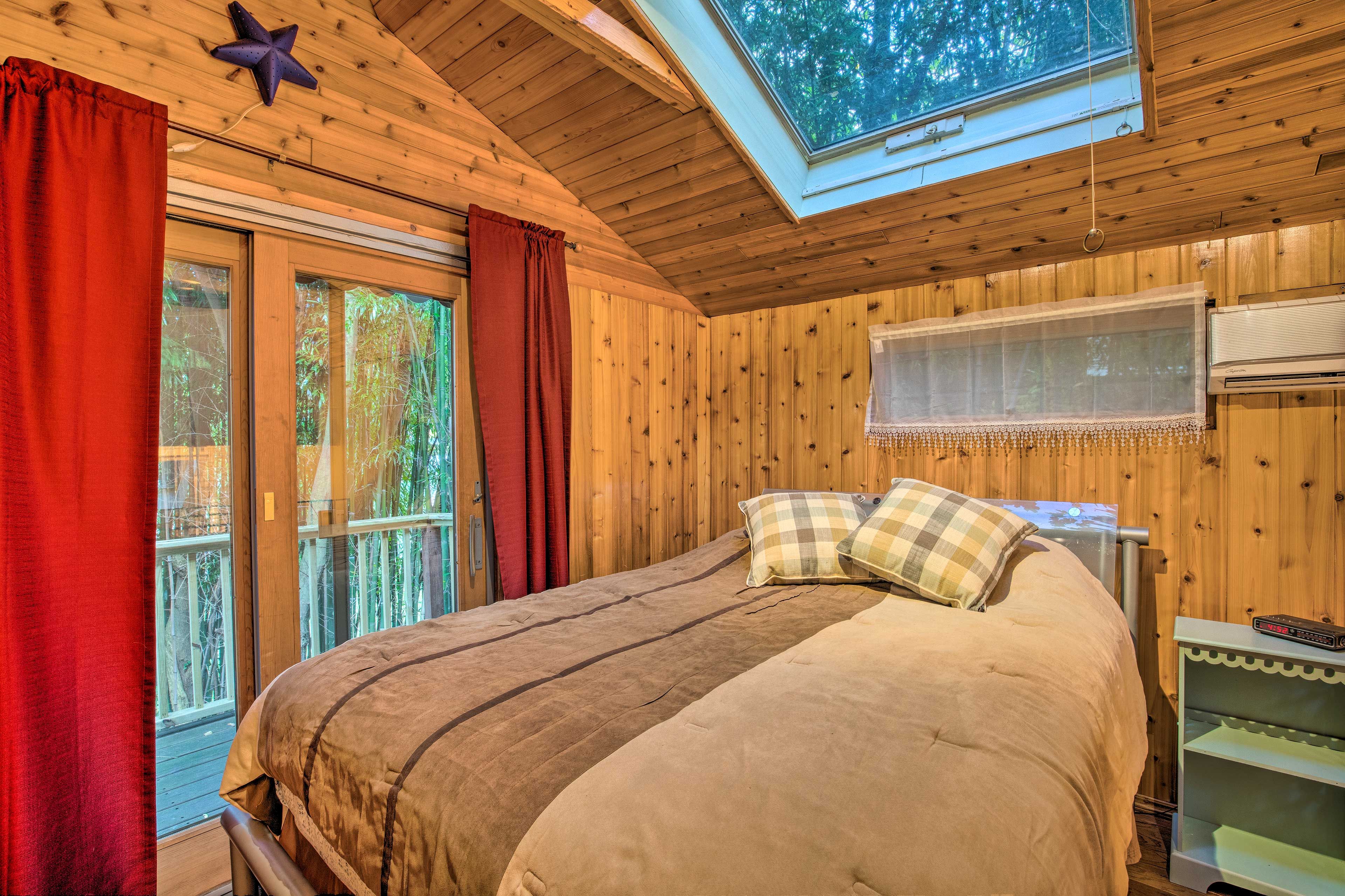 Curl up under the covers of this queen-sized bed.