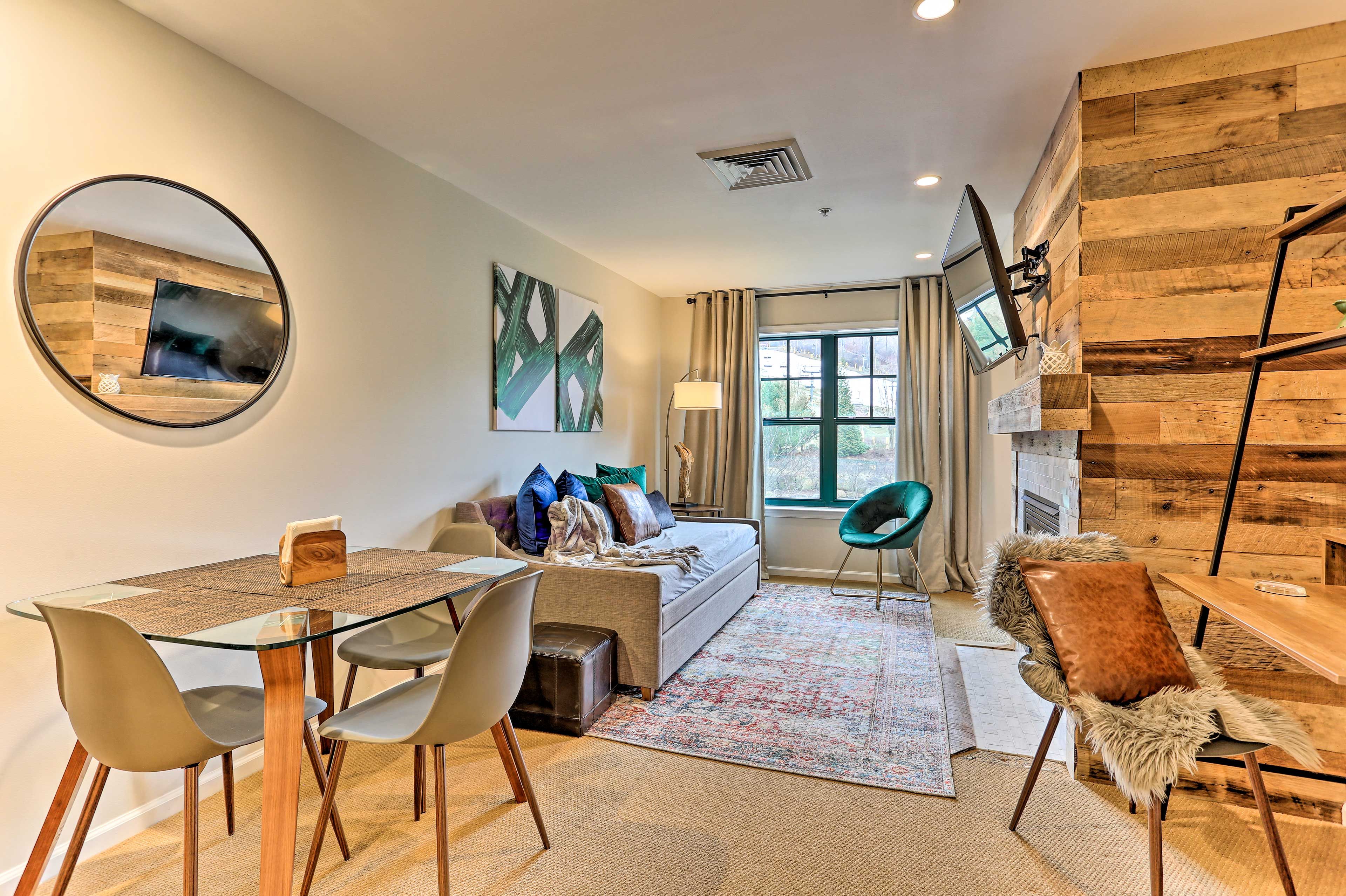 This modern condo features vibrant decor with a cozy feel.