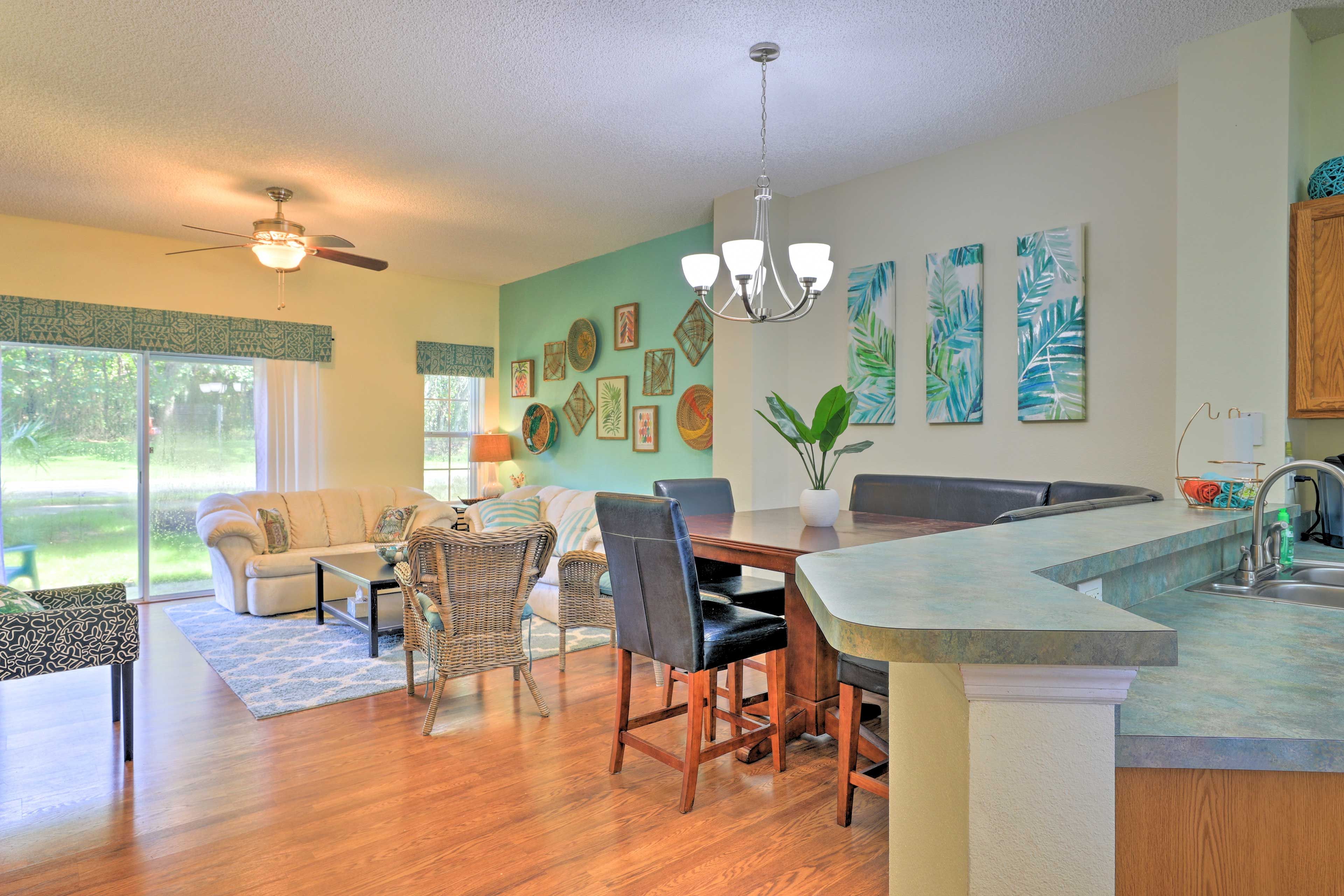 The living area leads into the fully equipped kitchen.