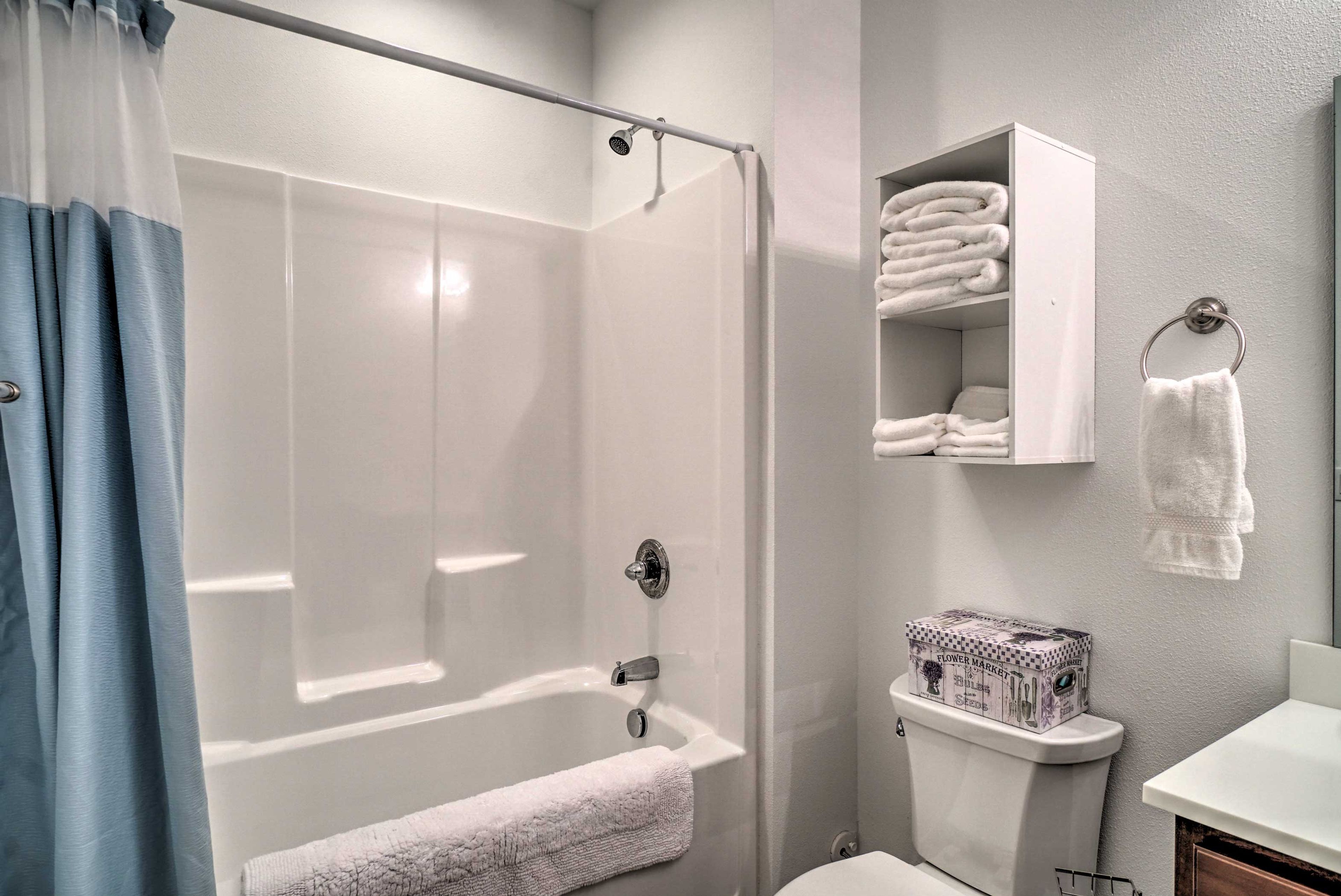 Wash away the day in the shower/tub combo.