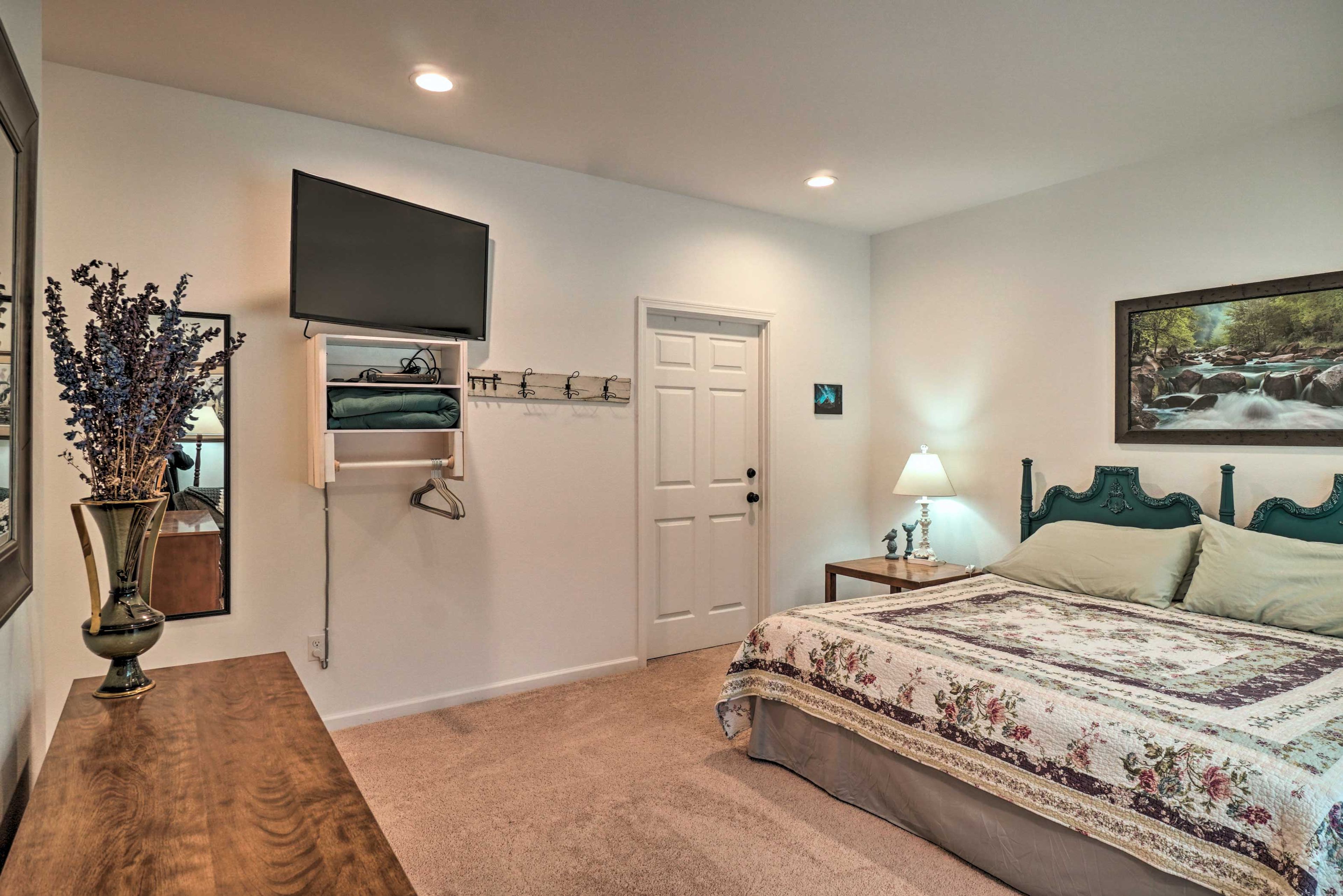 Watch a show on the flat-screen TV from the comfort of your bed.