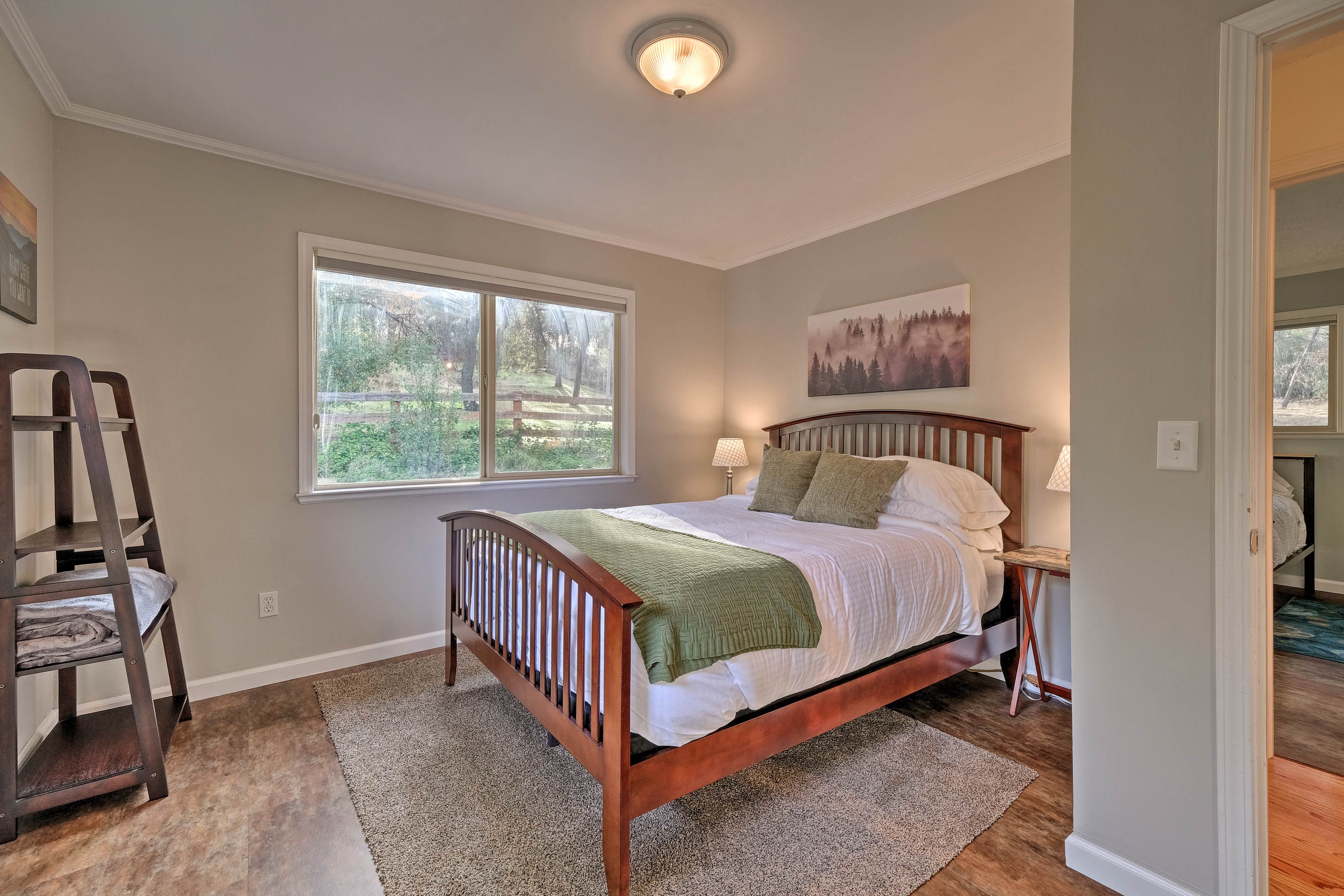 This bedroom boasts a queen bed.