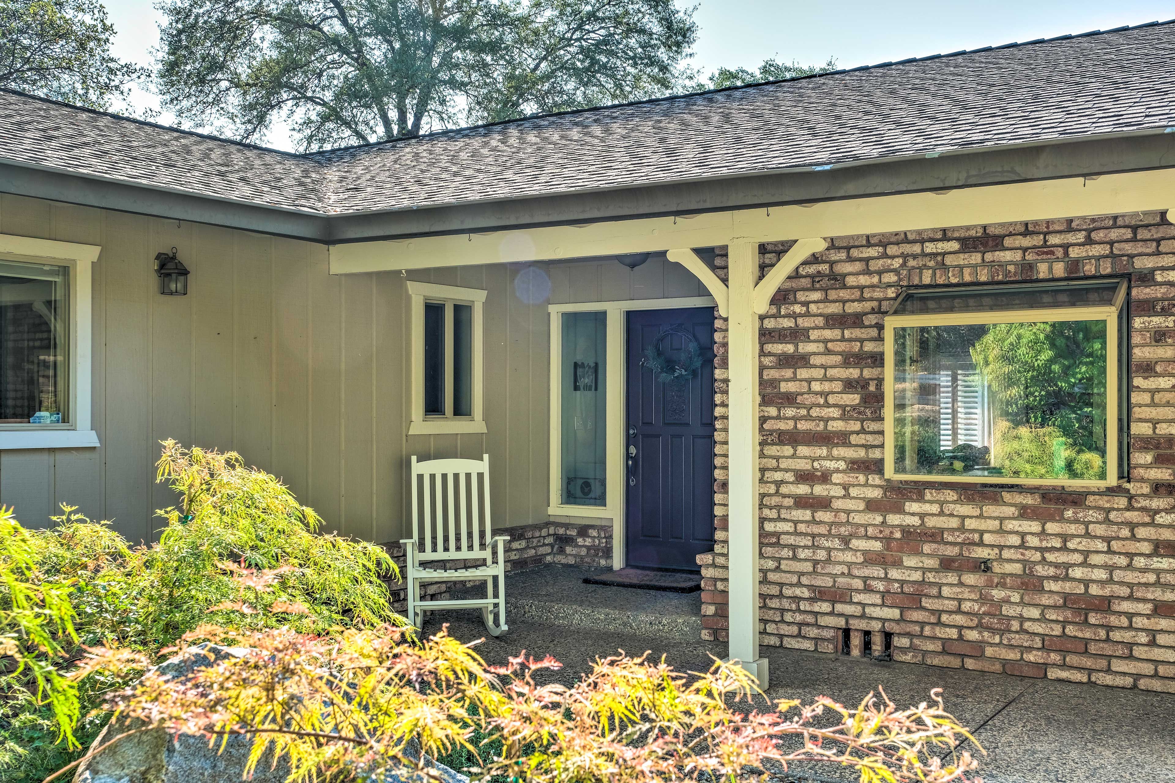 Enjoy a cup of coffee on this quaint front porch!