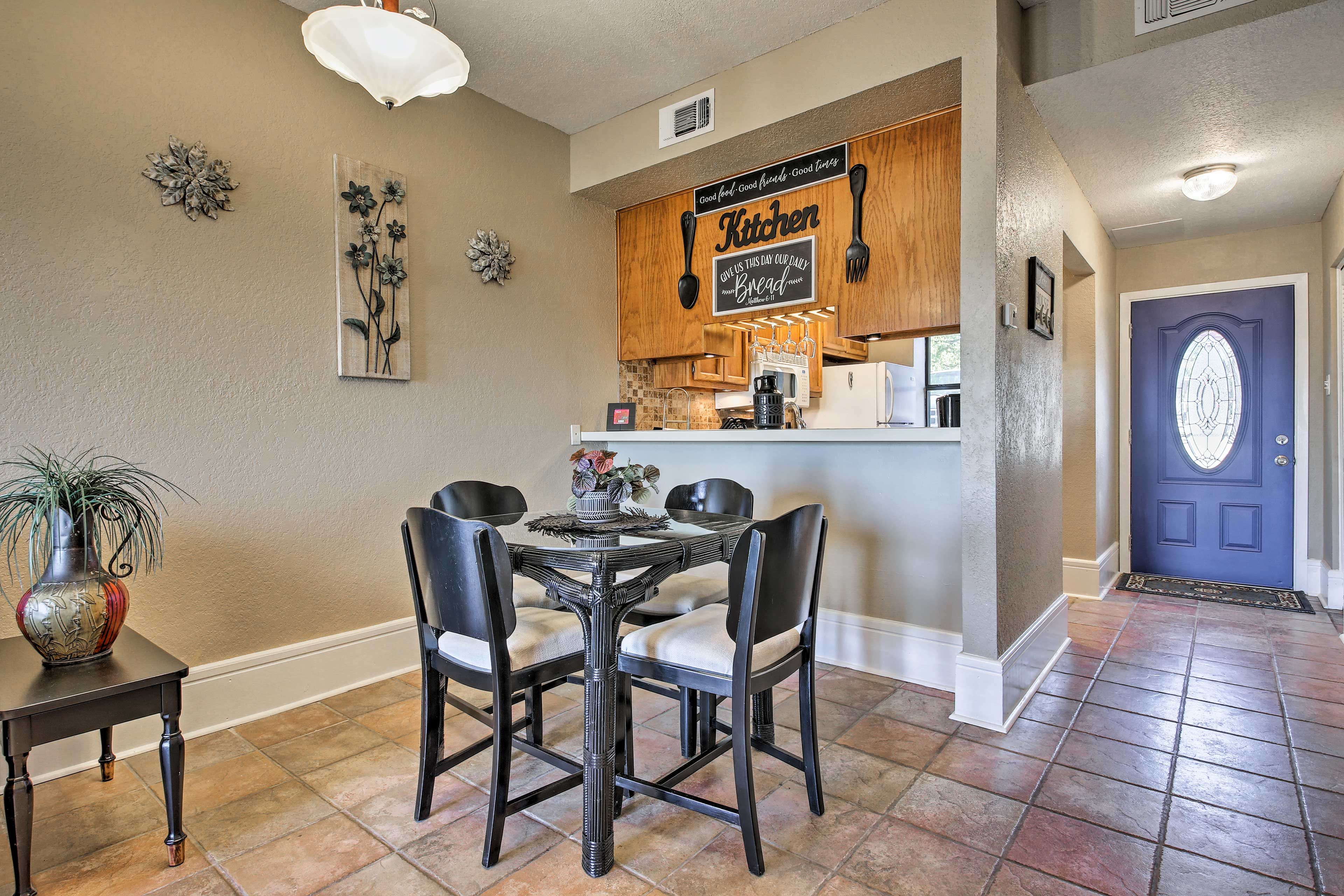 The open floor plan makes it easy to jump from the couch to the dining table.