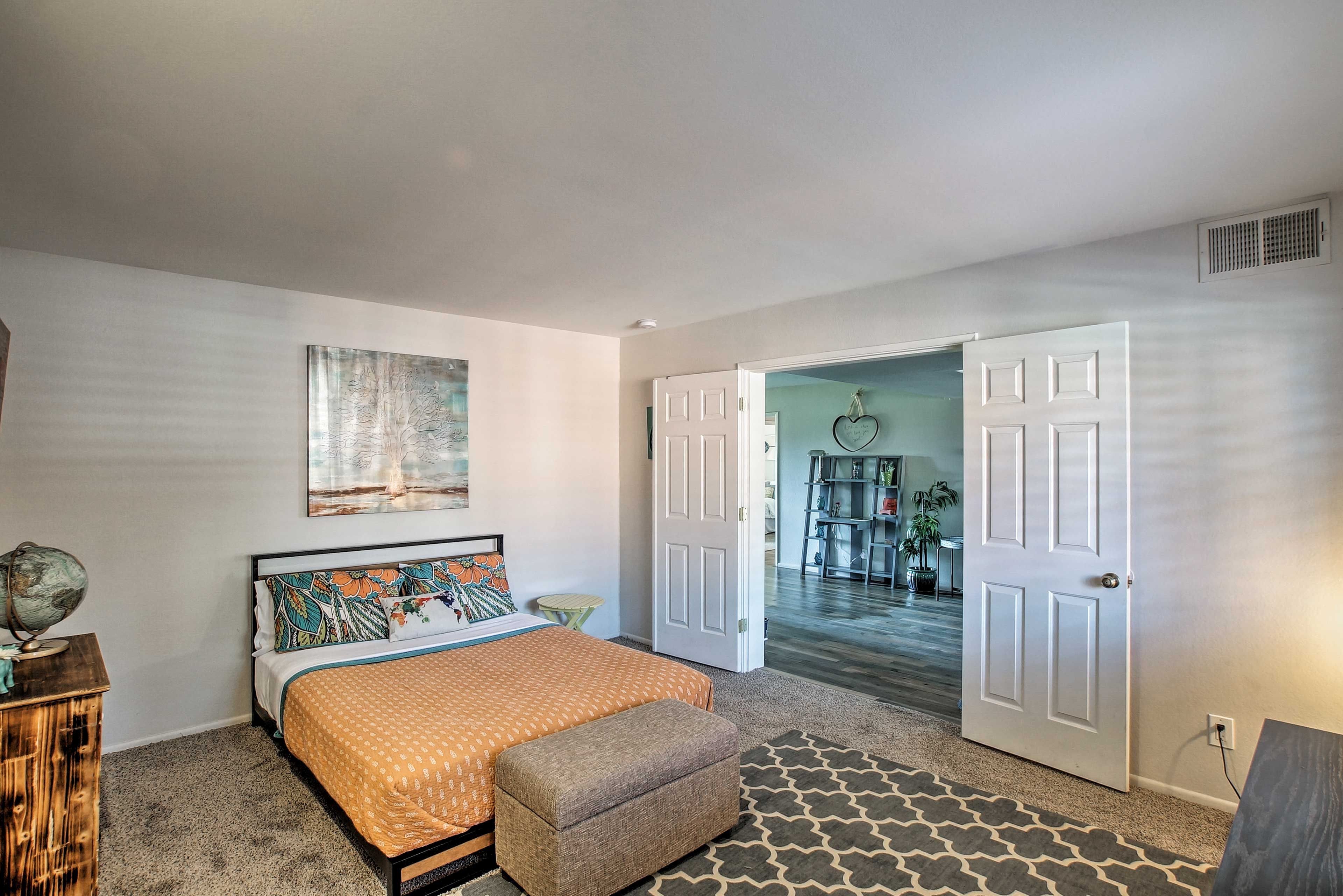The second bedroom has a queen-sized bed.