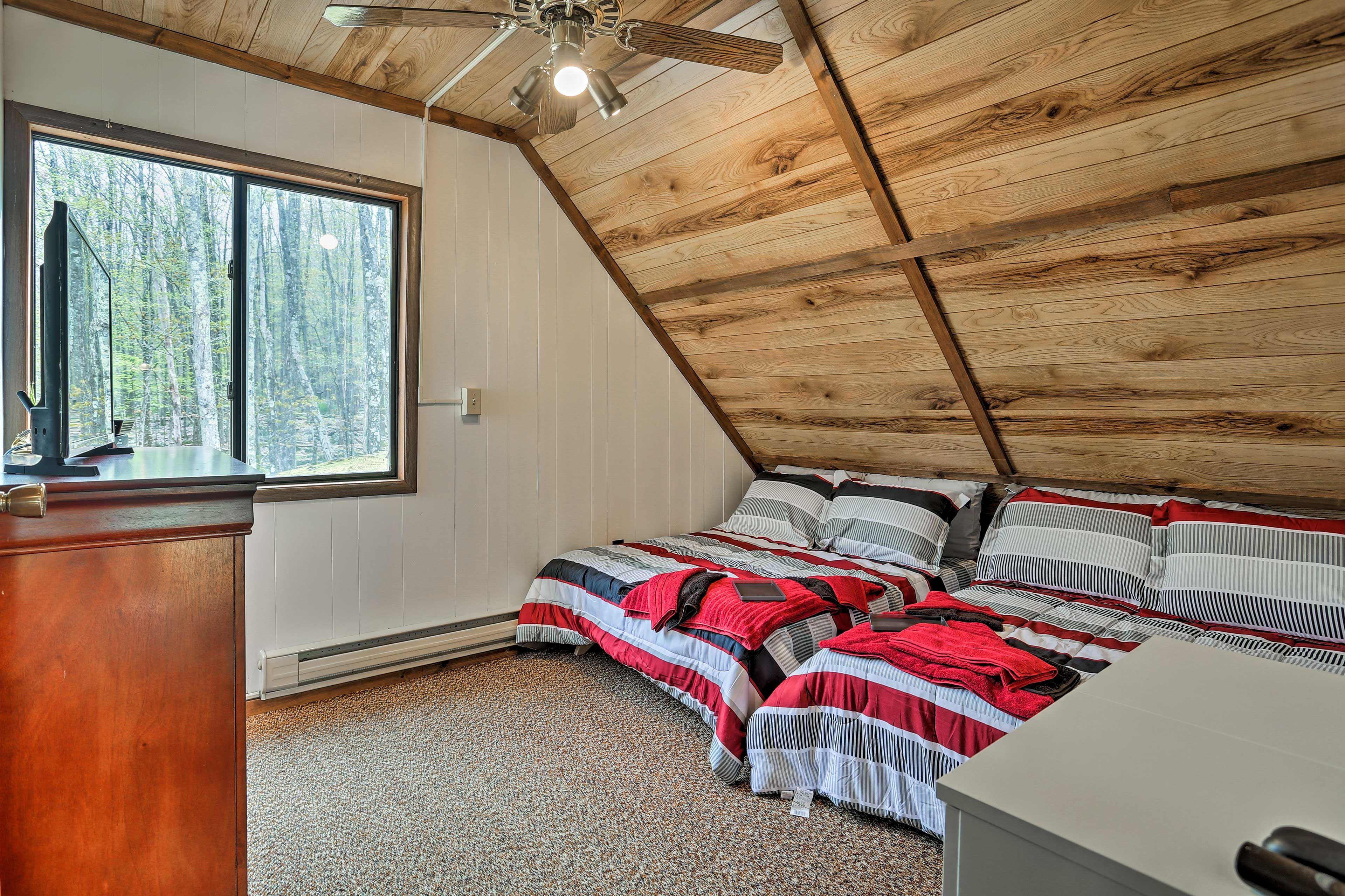 Head upstairs to find a set of full beds in this room.
