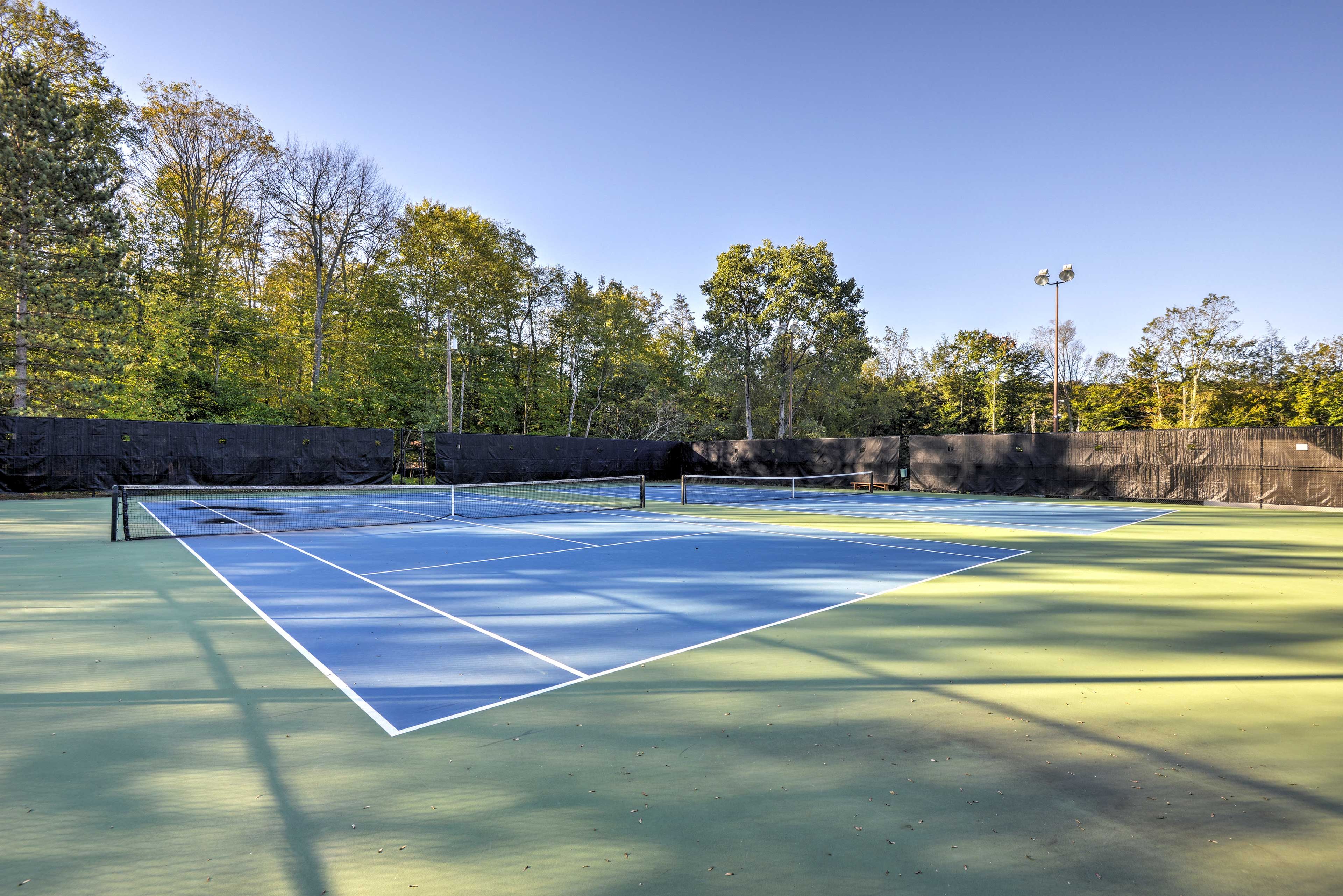 Play a friendly tennis match with your travel companions.