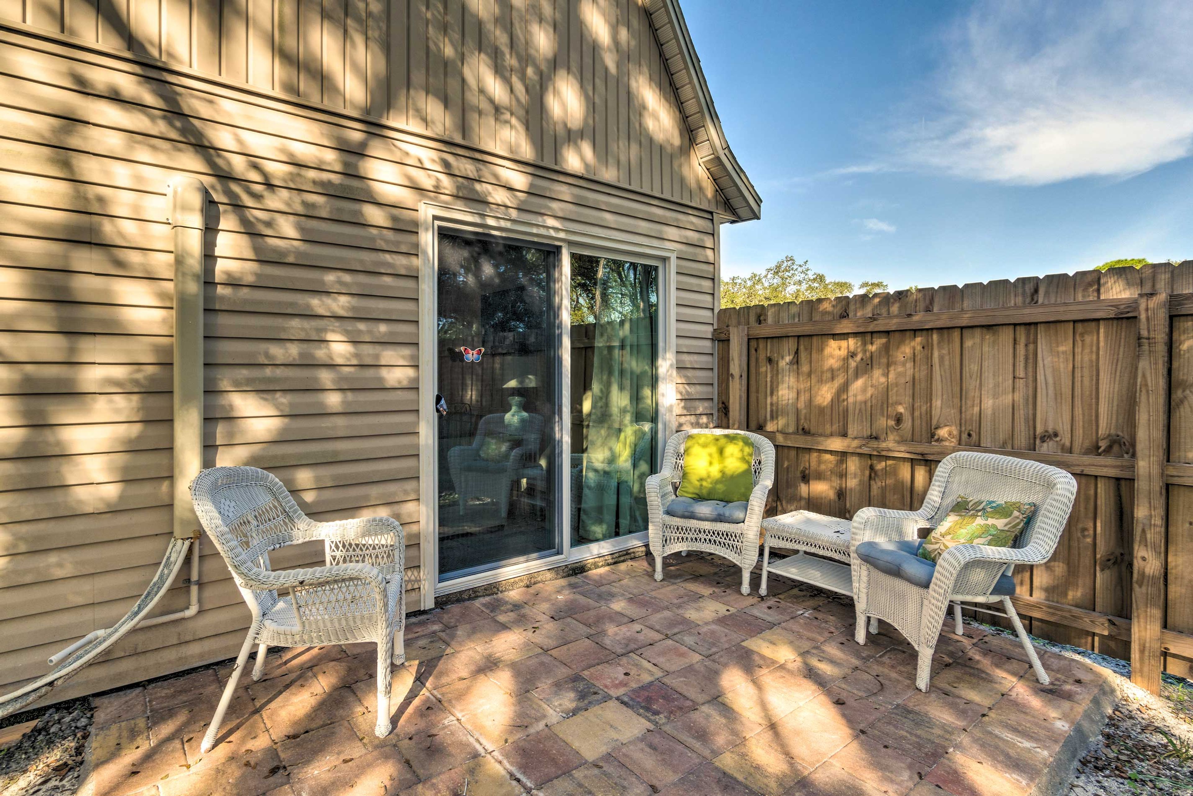 Sit out on the patio with a cocktail while the kids play in the yard.