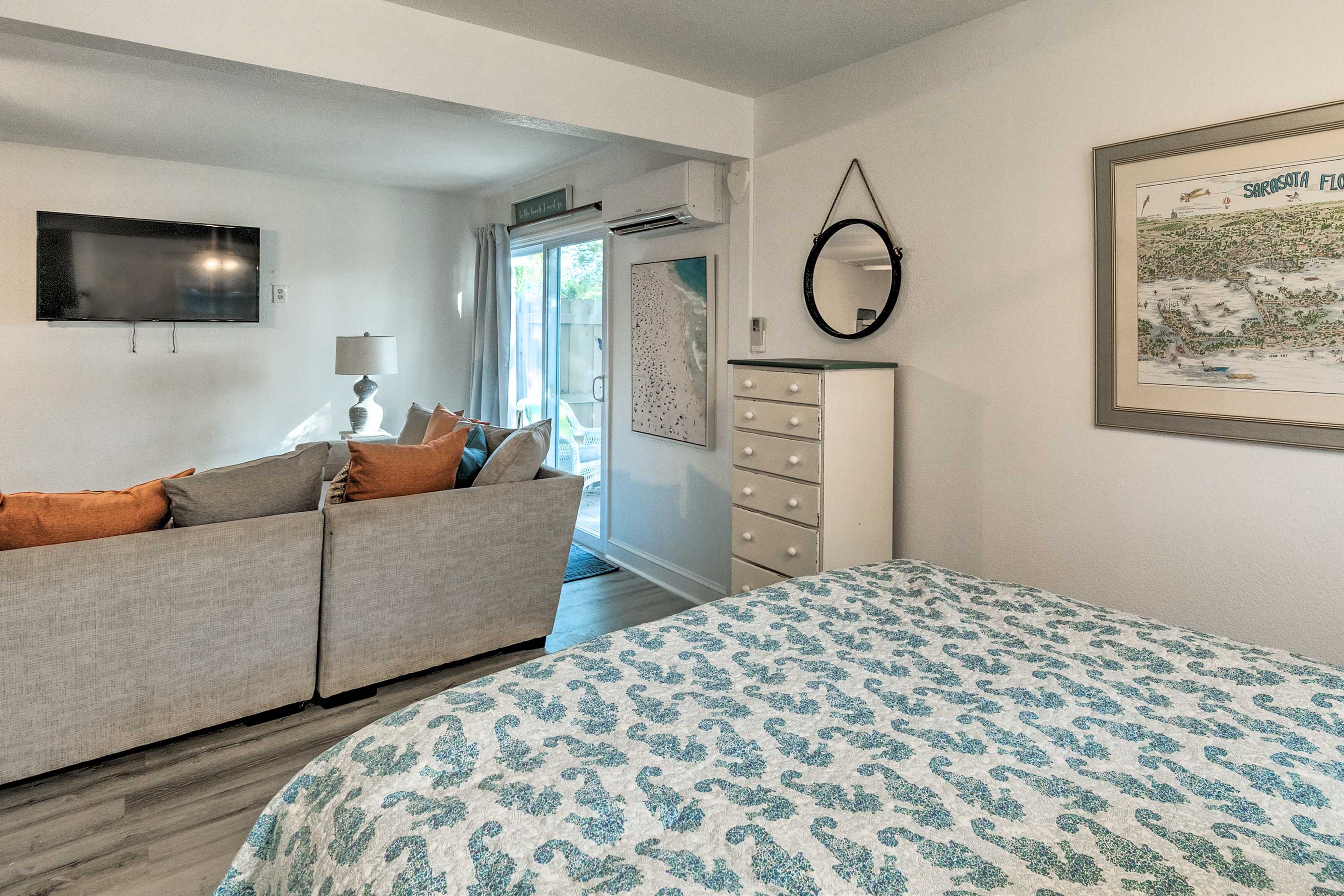 Those spending the night on this queen bed can fall asleep to a movie.