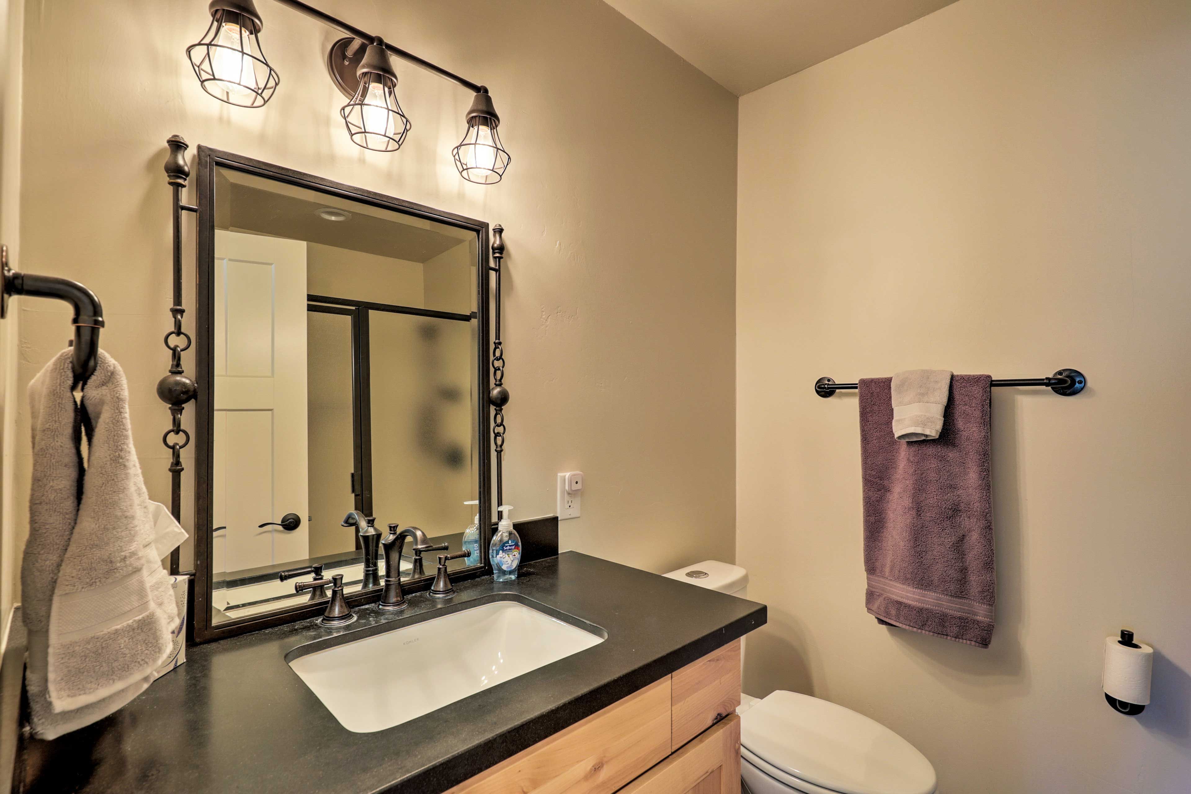 The second bath is complete with a walk-in shower and plenty of towels.