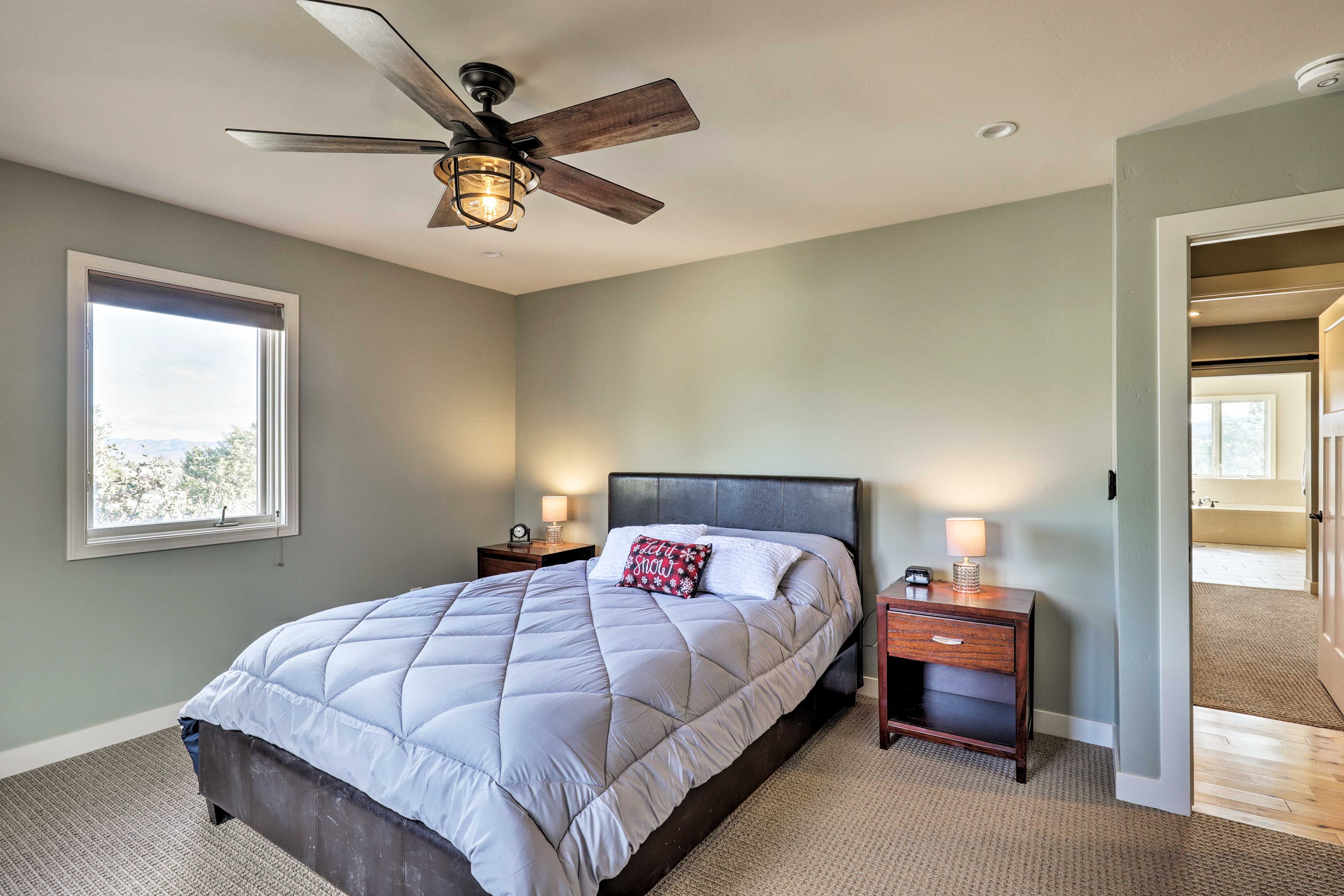 The second bedroom is equipped with a queen-sized bed.
