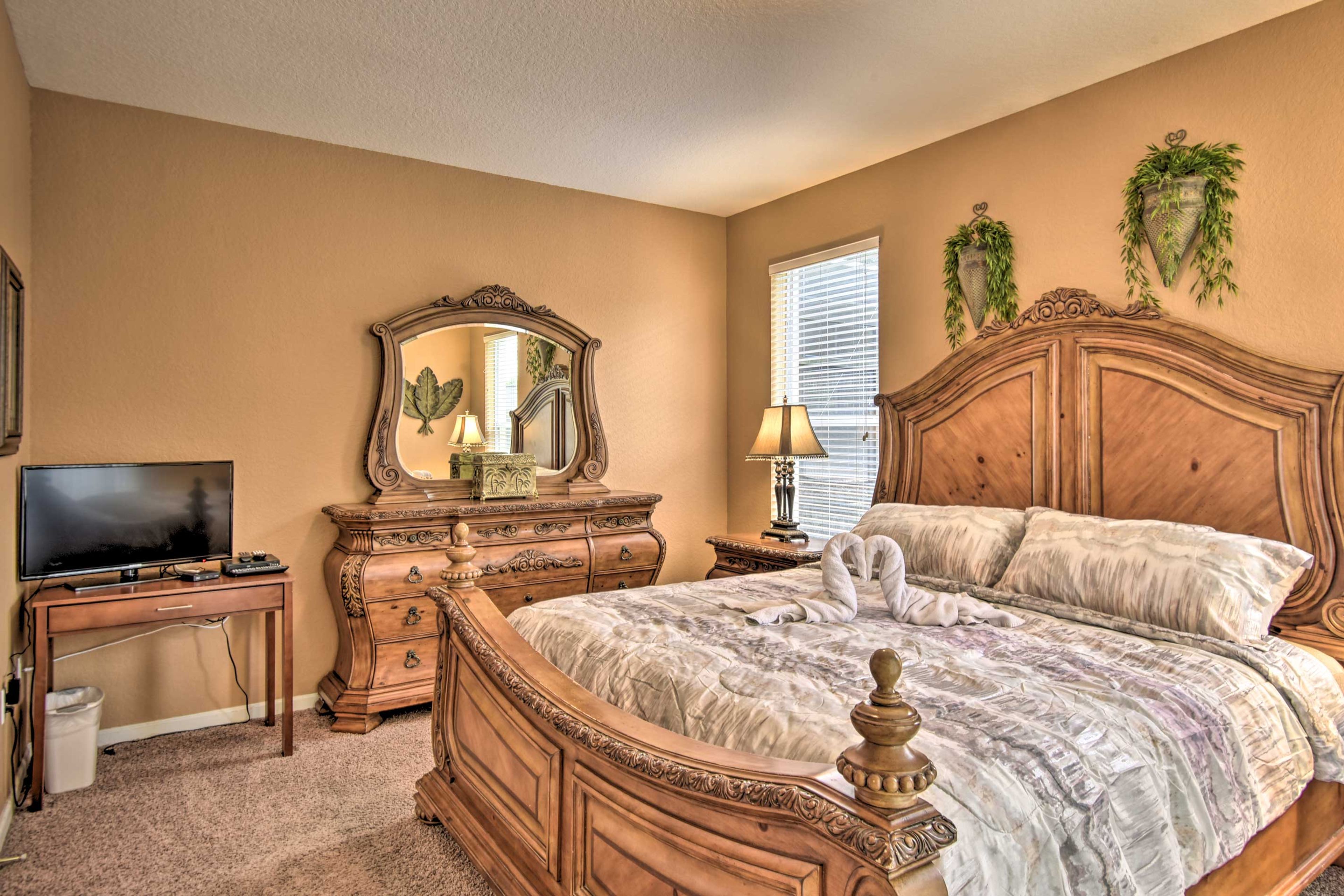 The first bedroom hosts a king-sized bed.
