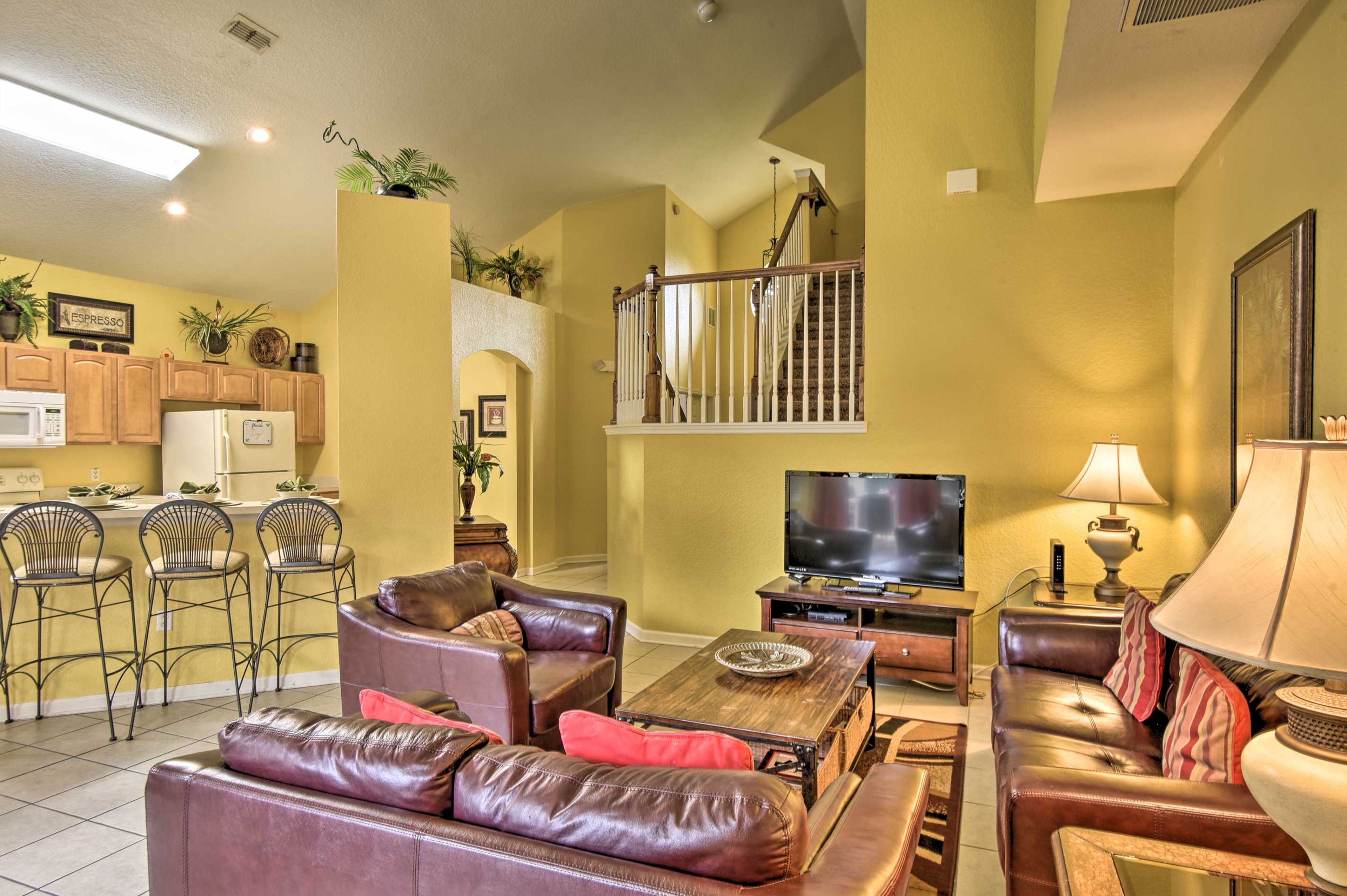 Natural light pours in through the floor-to-ceiling windows.