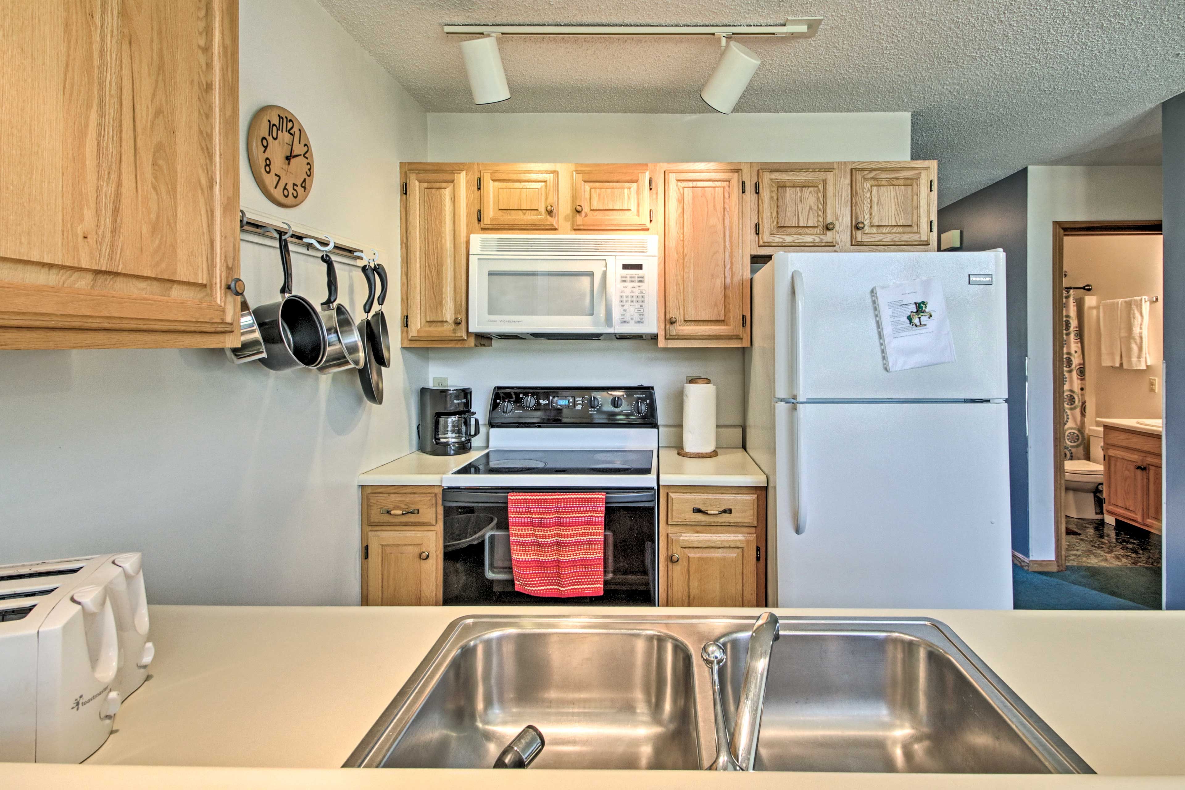 The kitchen comes fully equipped with cooking essentials.