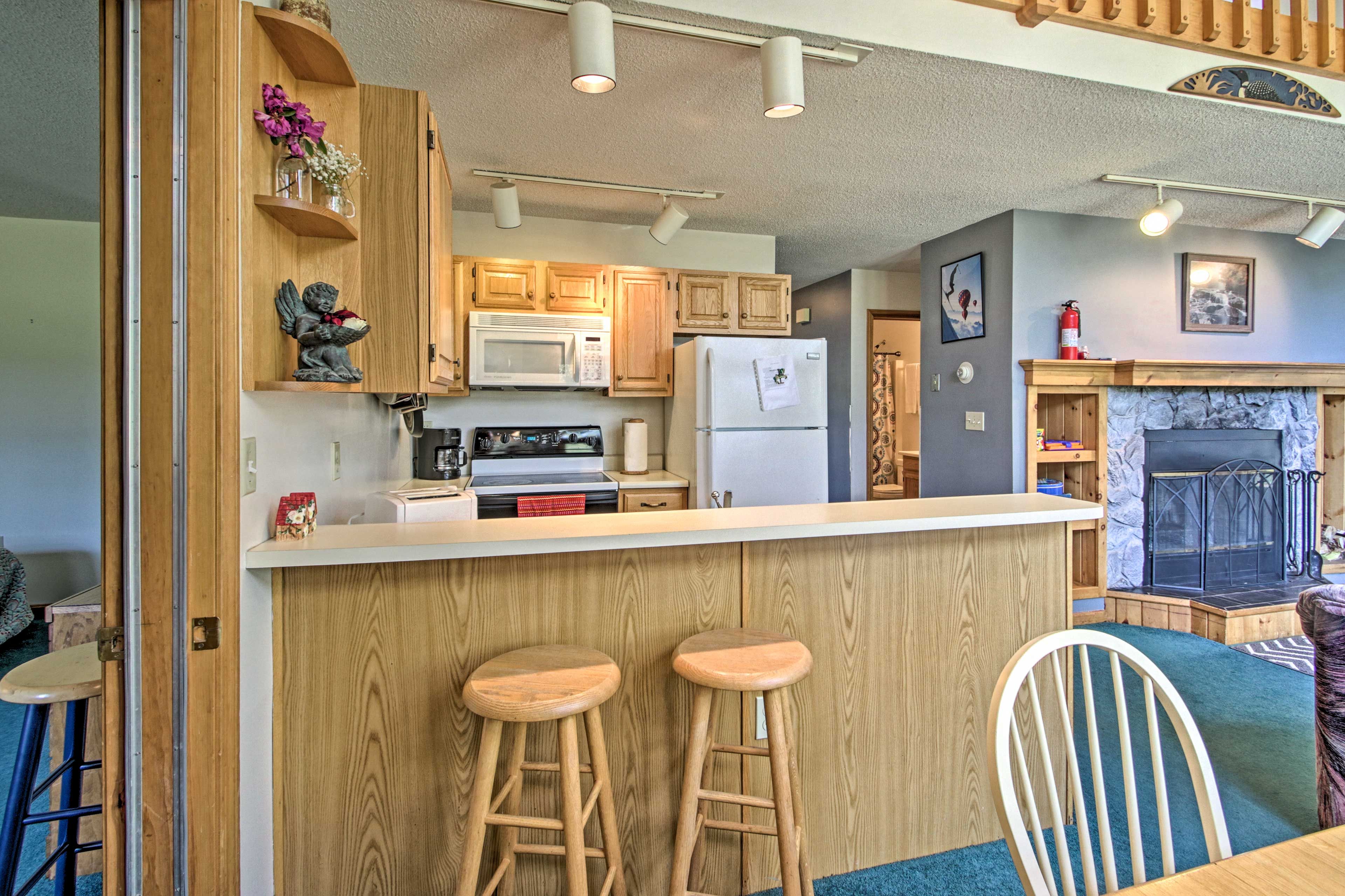 Sip a glass of wine at the breakfast bar while dinner is made.