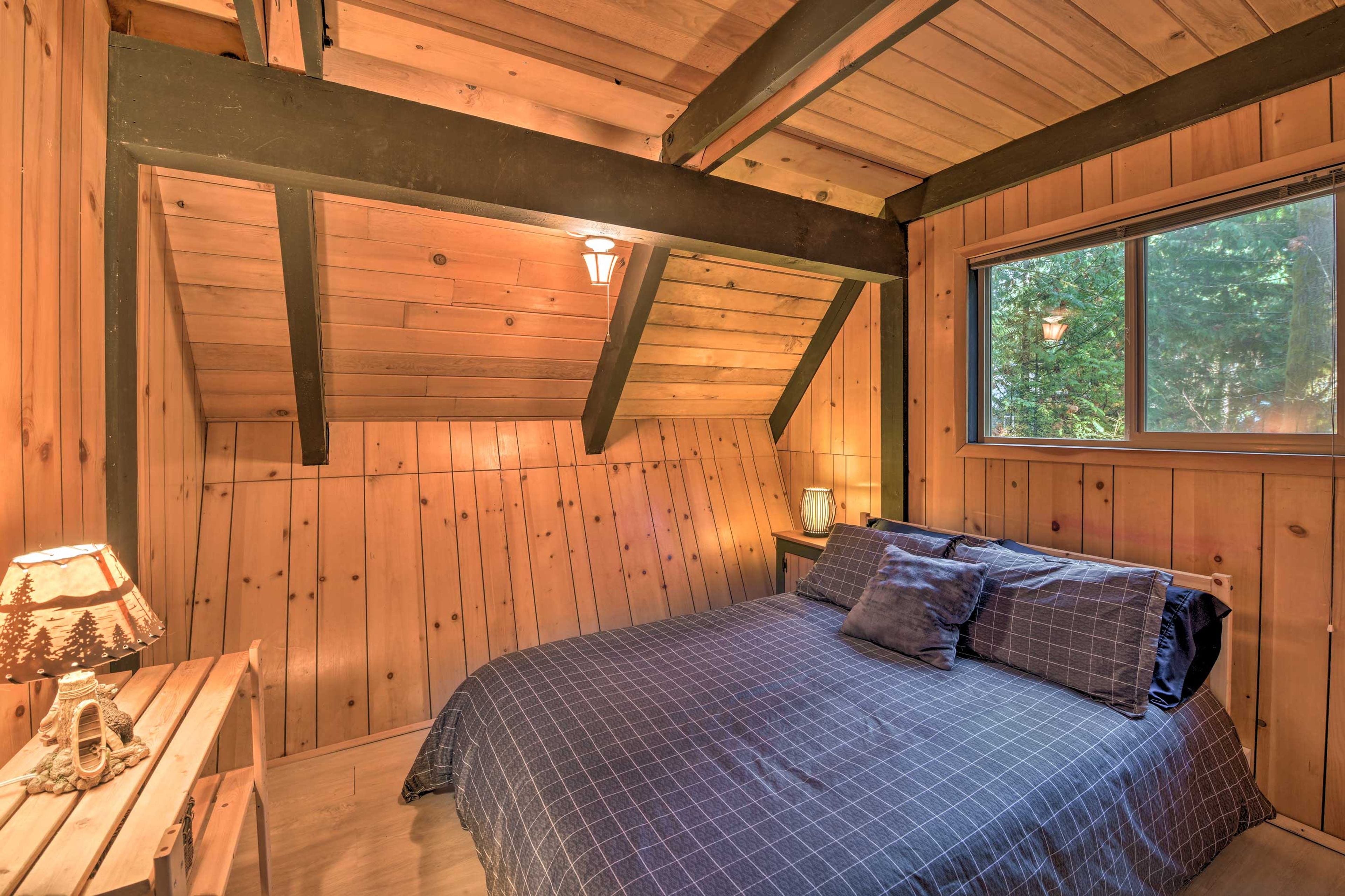 Natural light illuminates the downstairs bedroom.