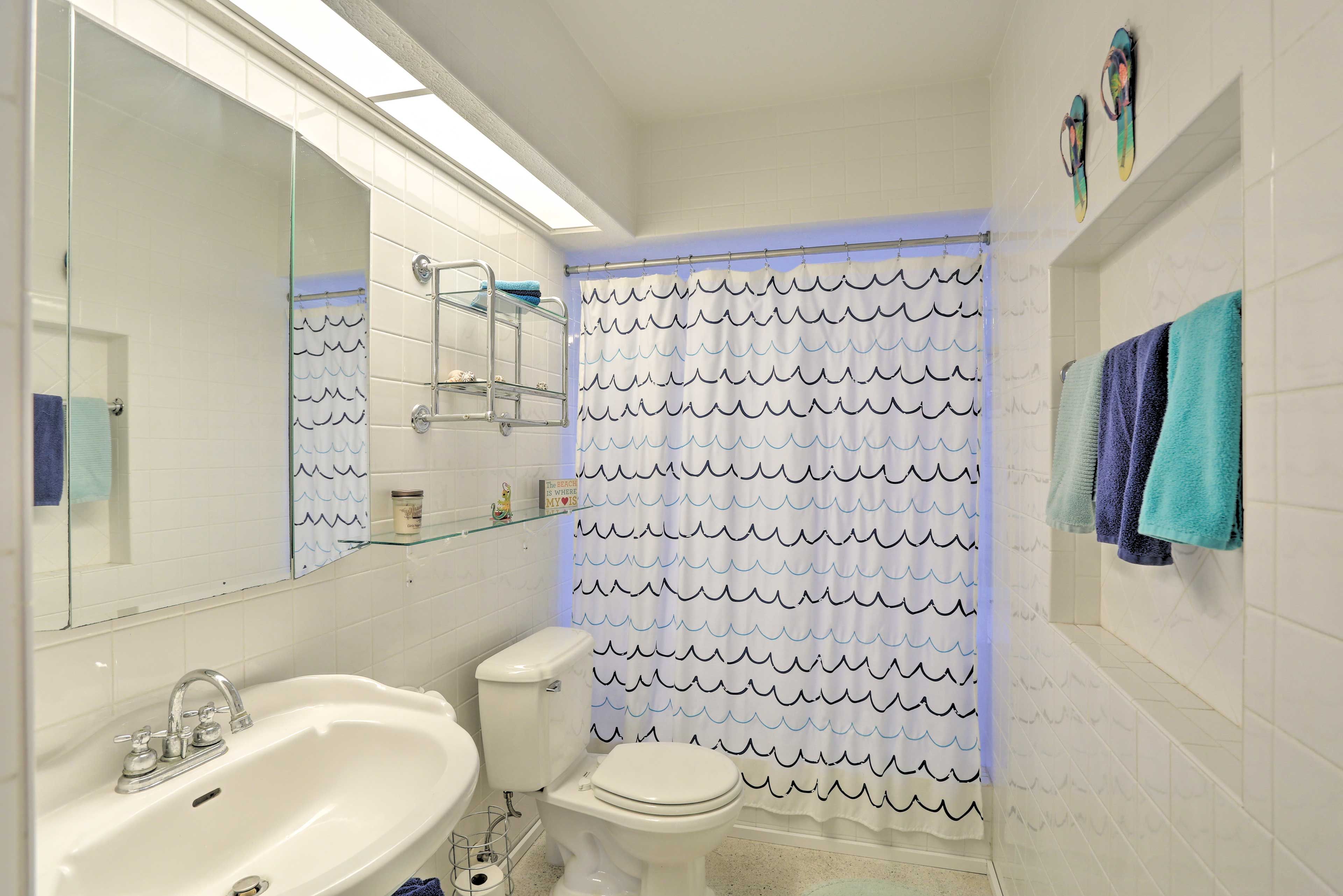 Each bathroom is stocked with fresh towels.