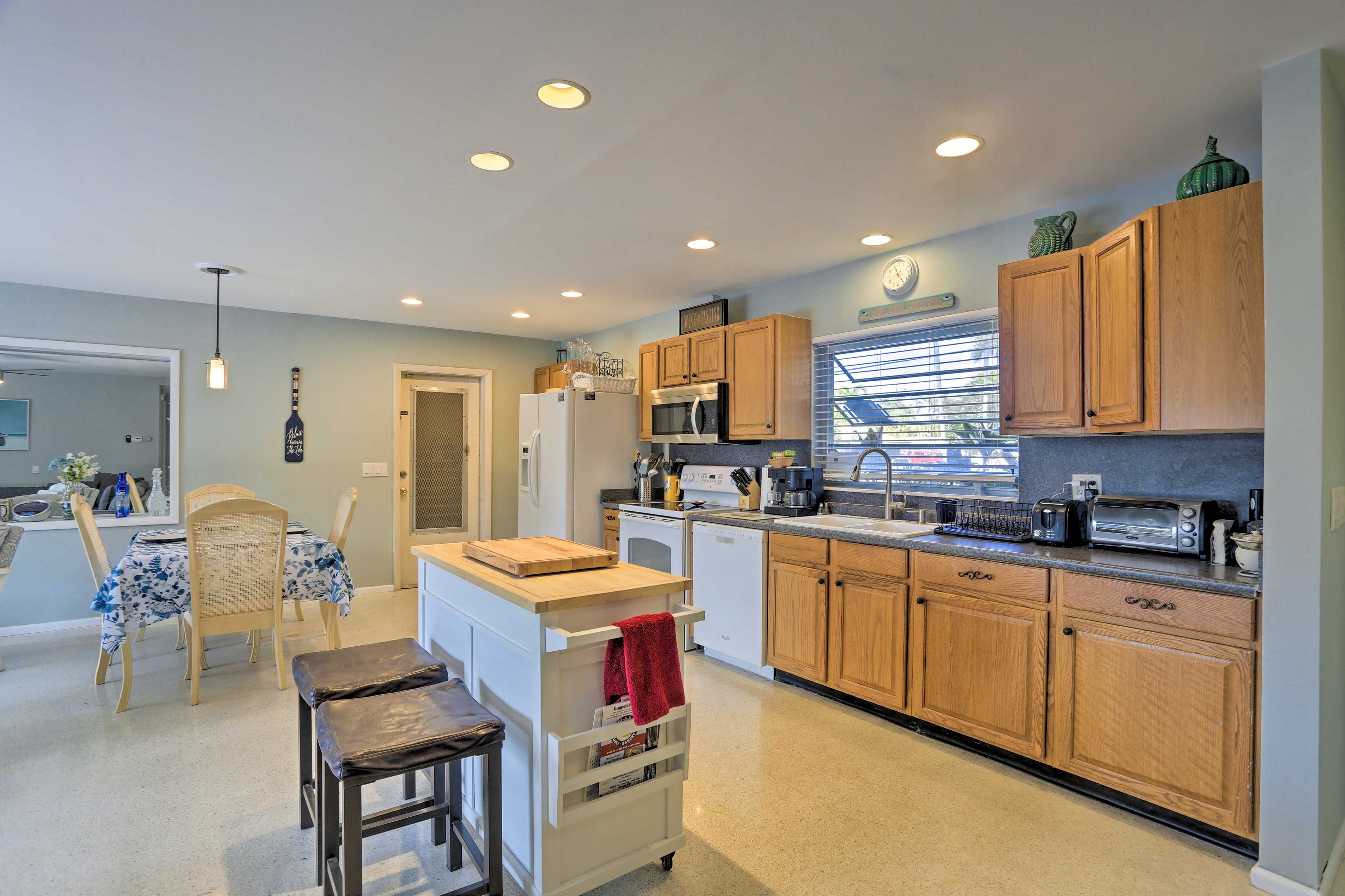 Gather around the dining table and island to enjoy meals.