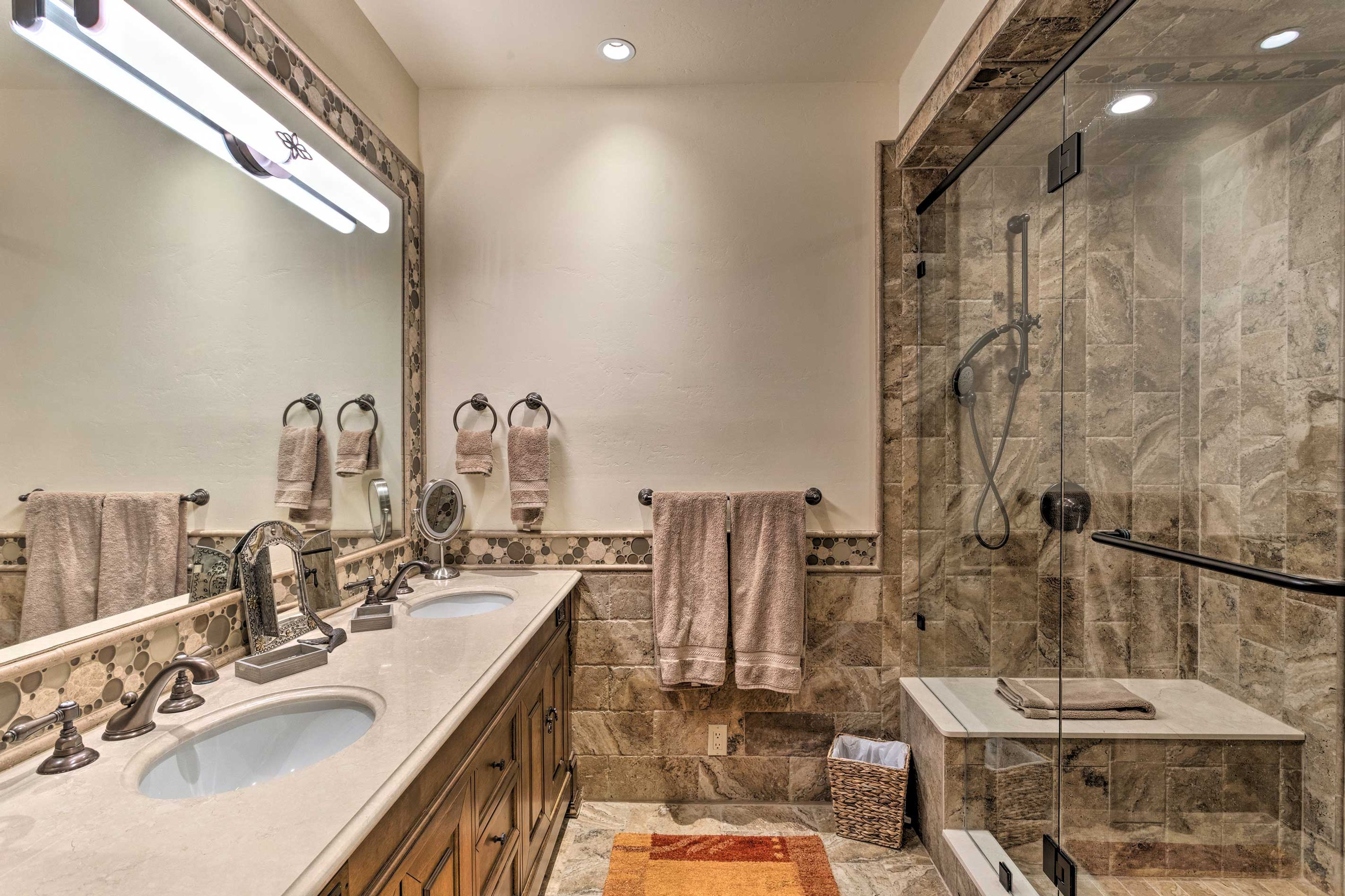 The 6th en-suite bath is complete with double sinks & a gorgeous walk-in shower.