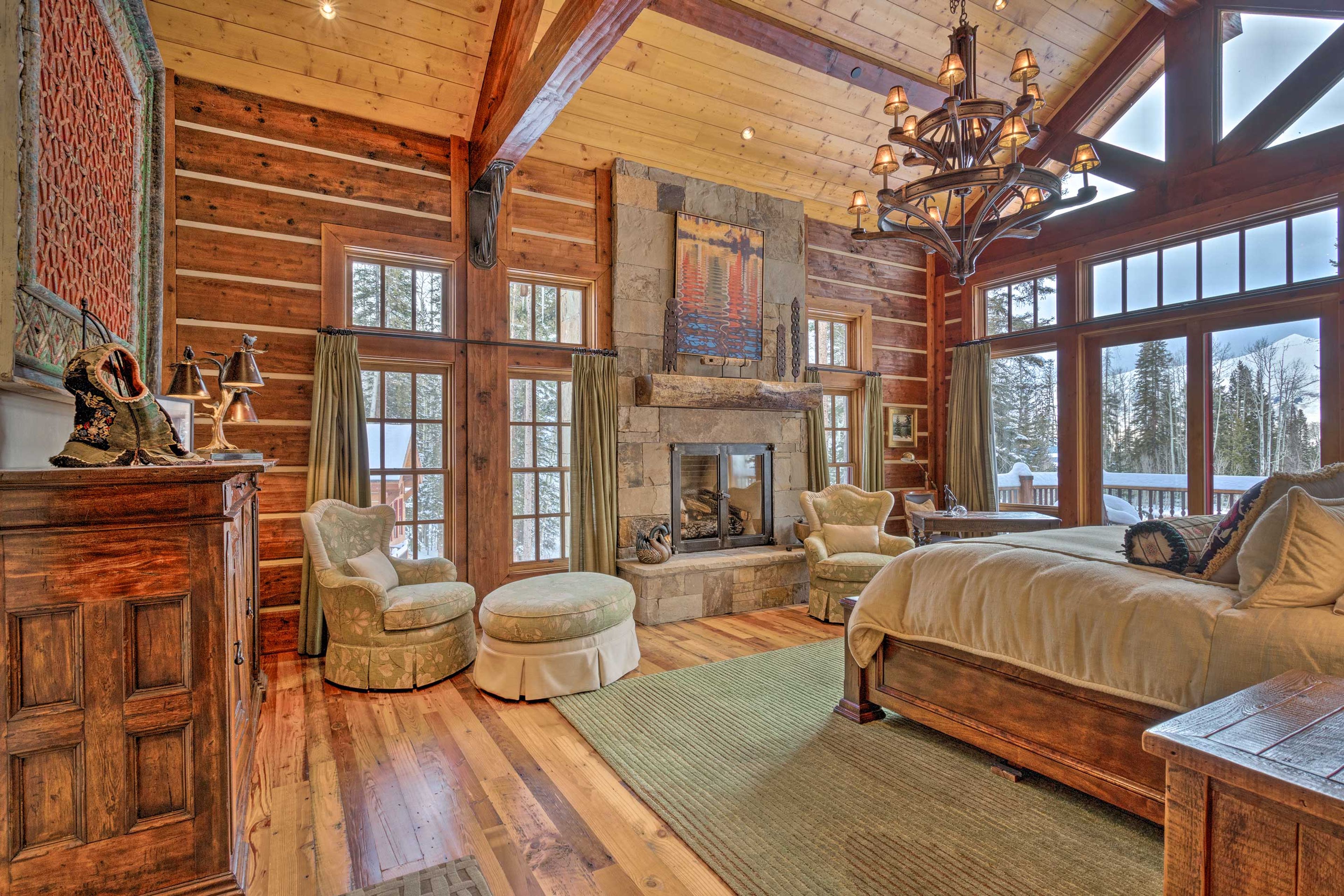 The luxurious first suite features a king-sized bed & a stone fireplace.