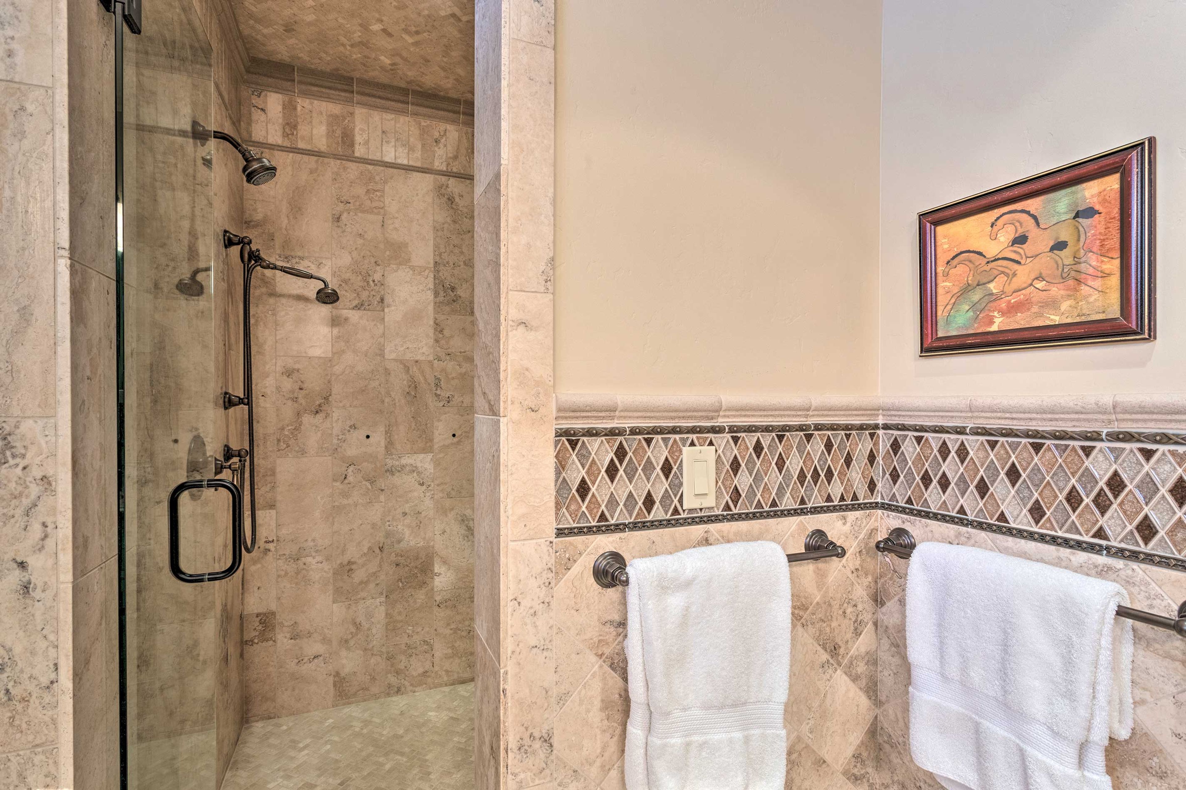 It is also complete with a beautiful walk-in shower and plenty of towels.
