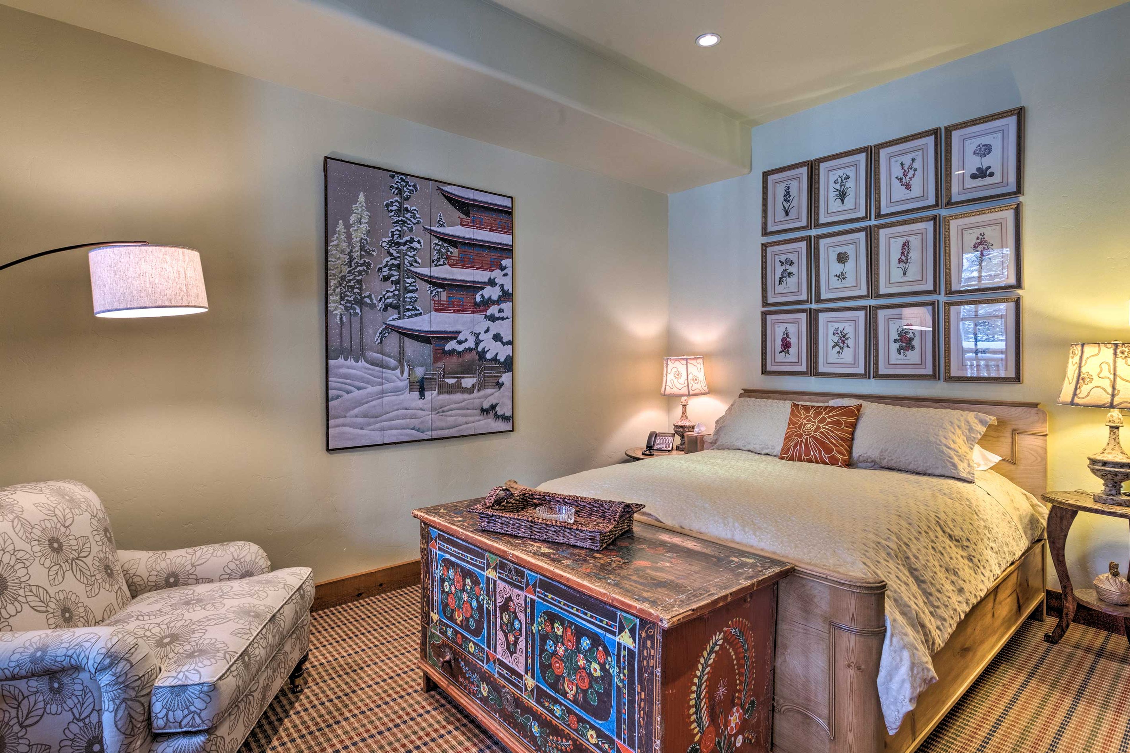 The third bedroom is equipped with a queen-sized bed.