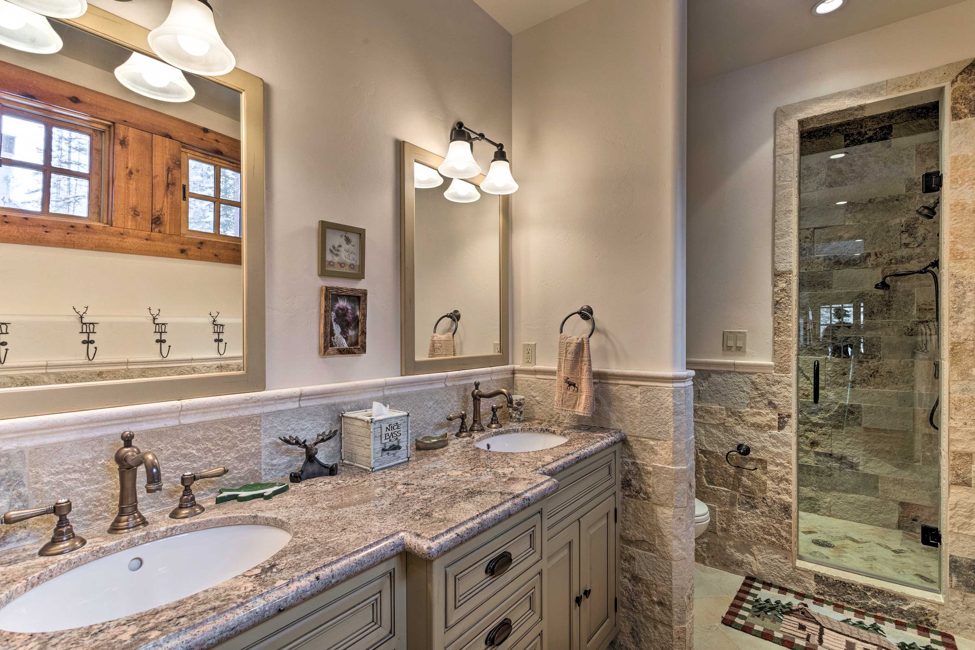 The fifth en-suite bath is complete with double sinks and a walk-in shower.