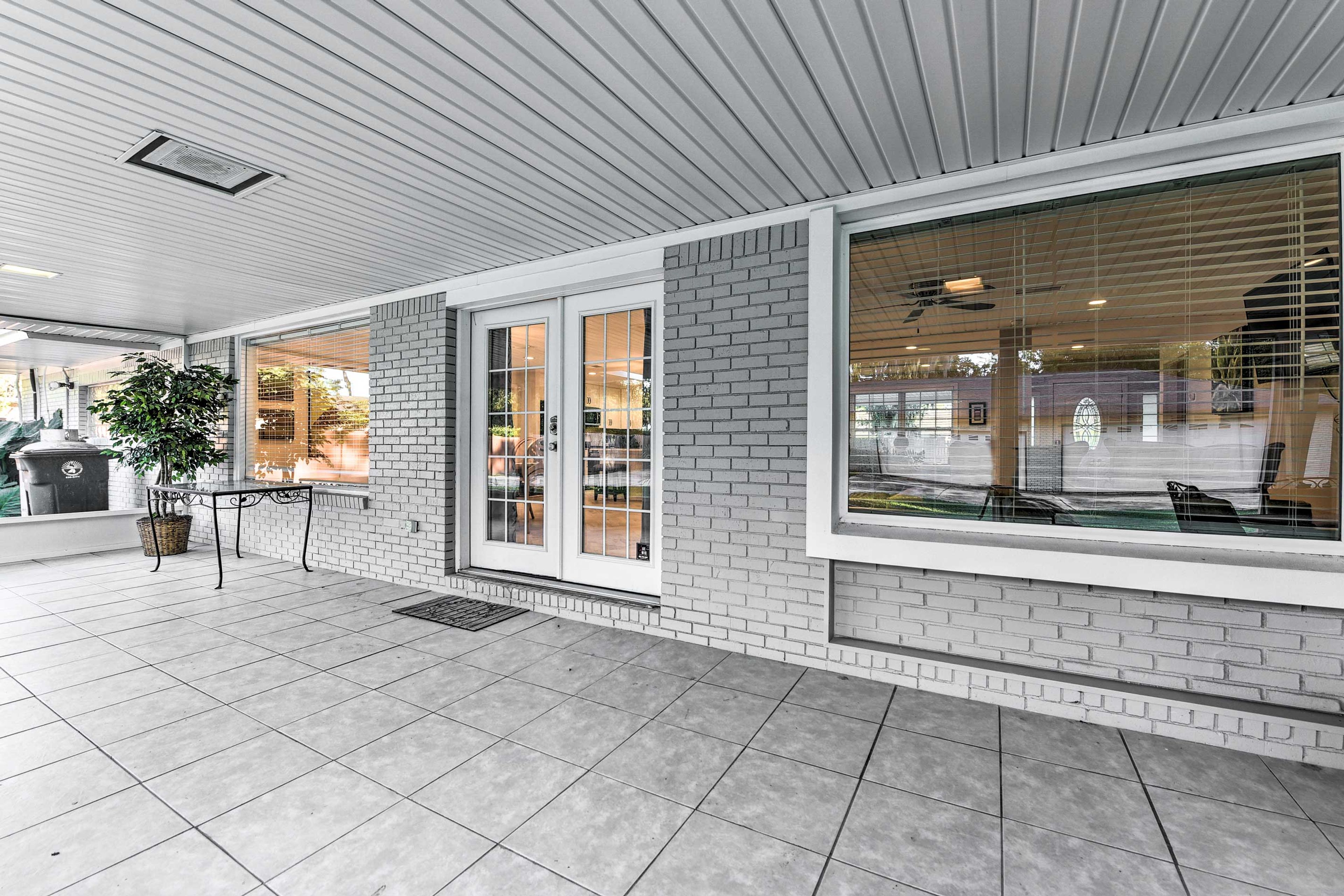 This covered back patio is ideal for enjoying your 5 o'clock drink of choice!