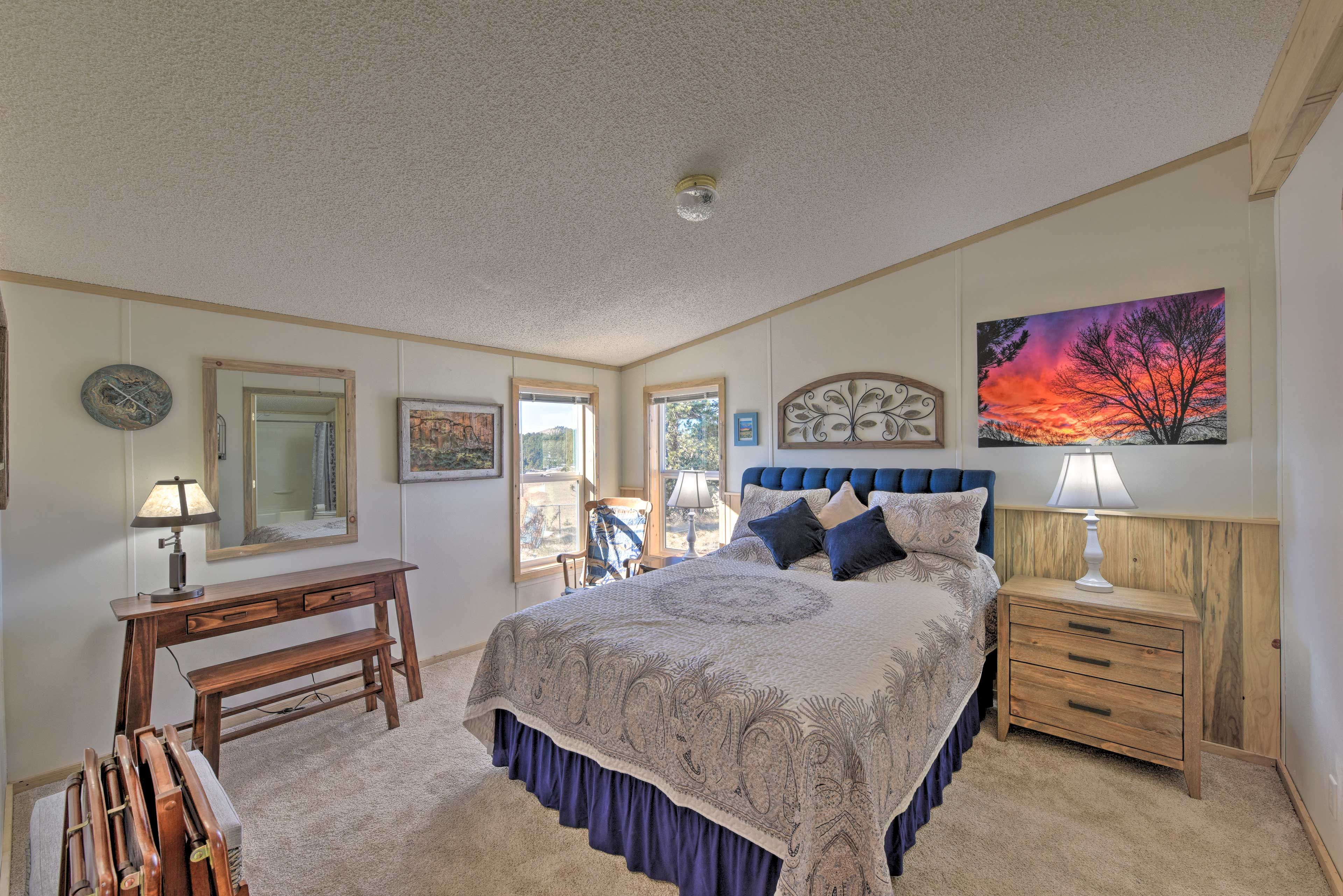 Two guests can rest up in this queen-sized bed.