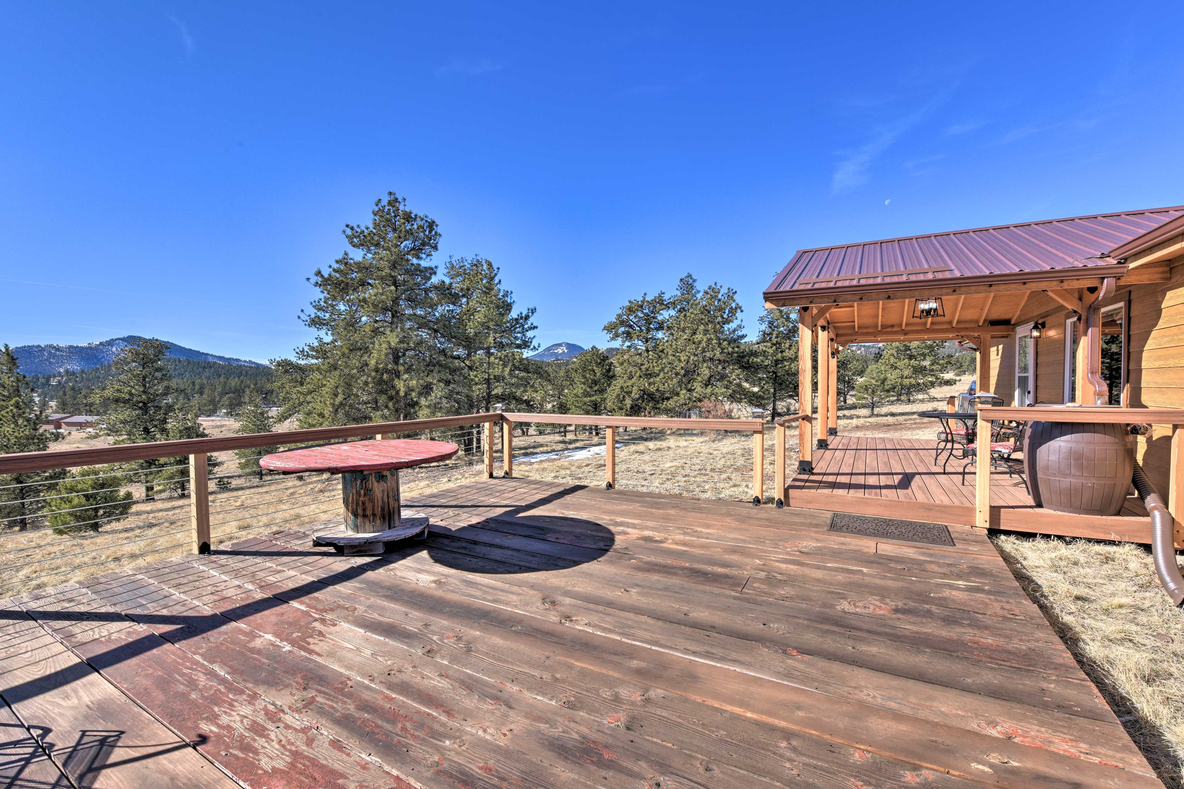 The spacious deck invites you to unwind with mountain views.