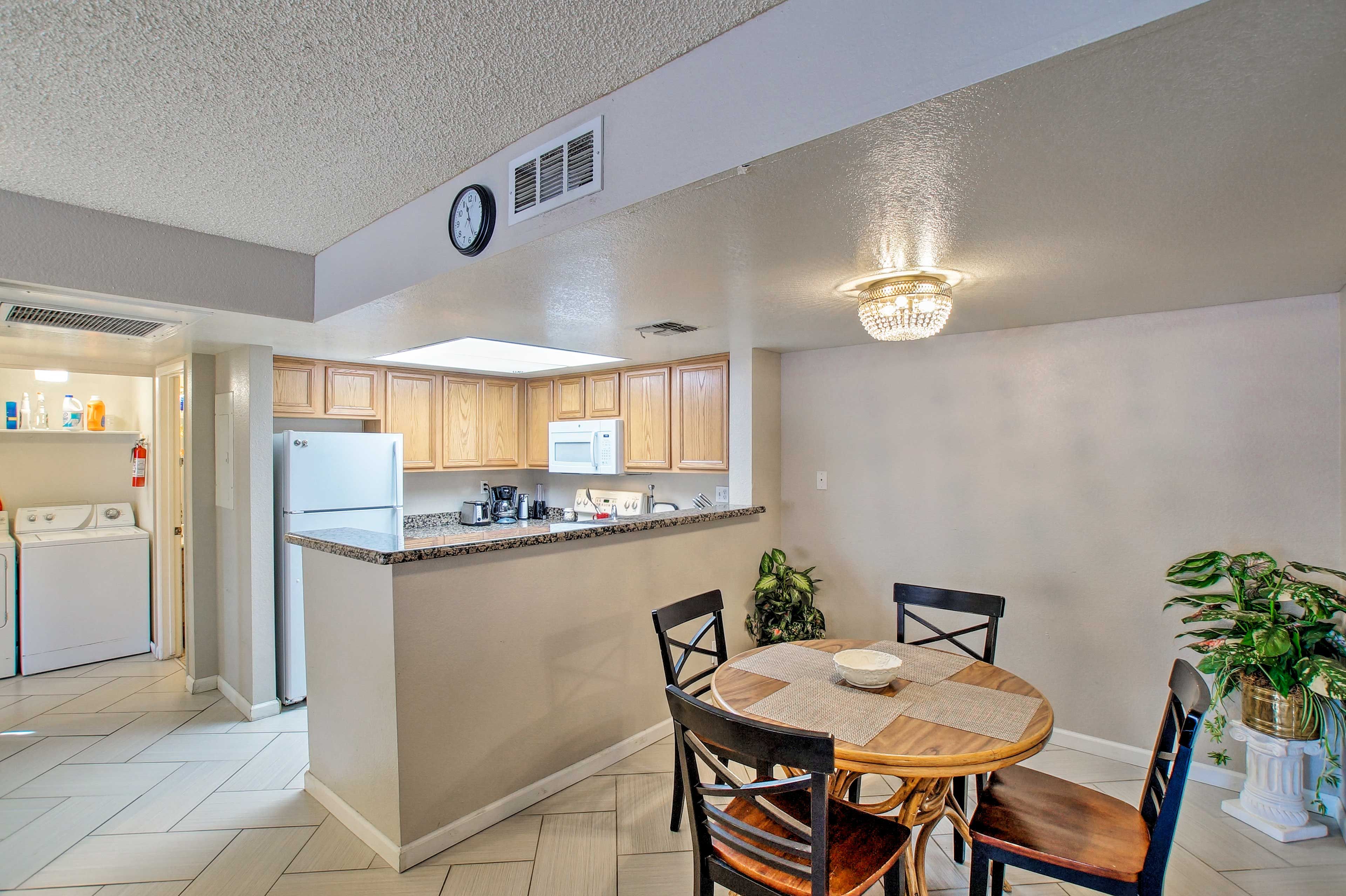 The living room leads directly into the dining area and kitchen.