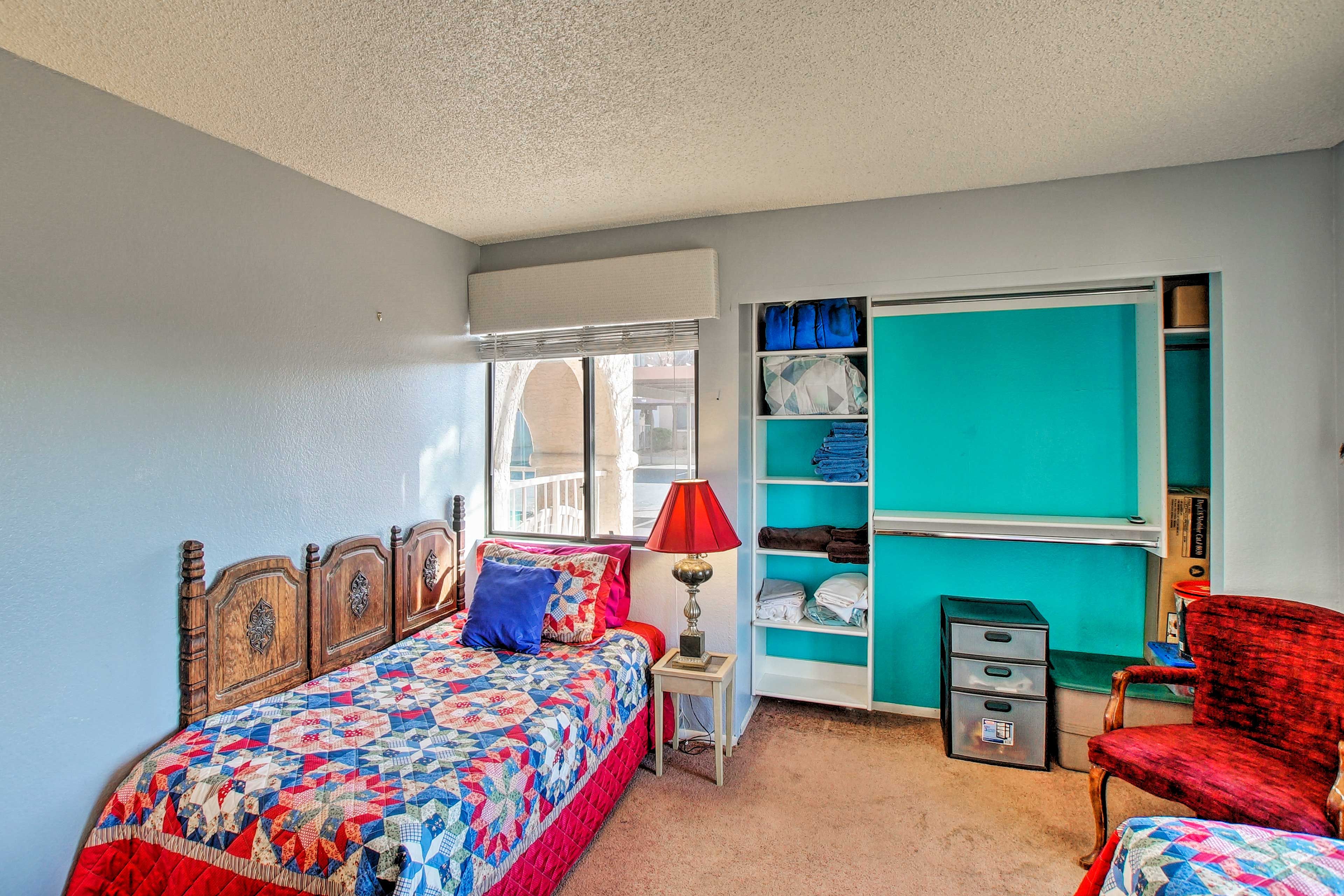 The second bedroom is complete with 2 twin-sized beds.