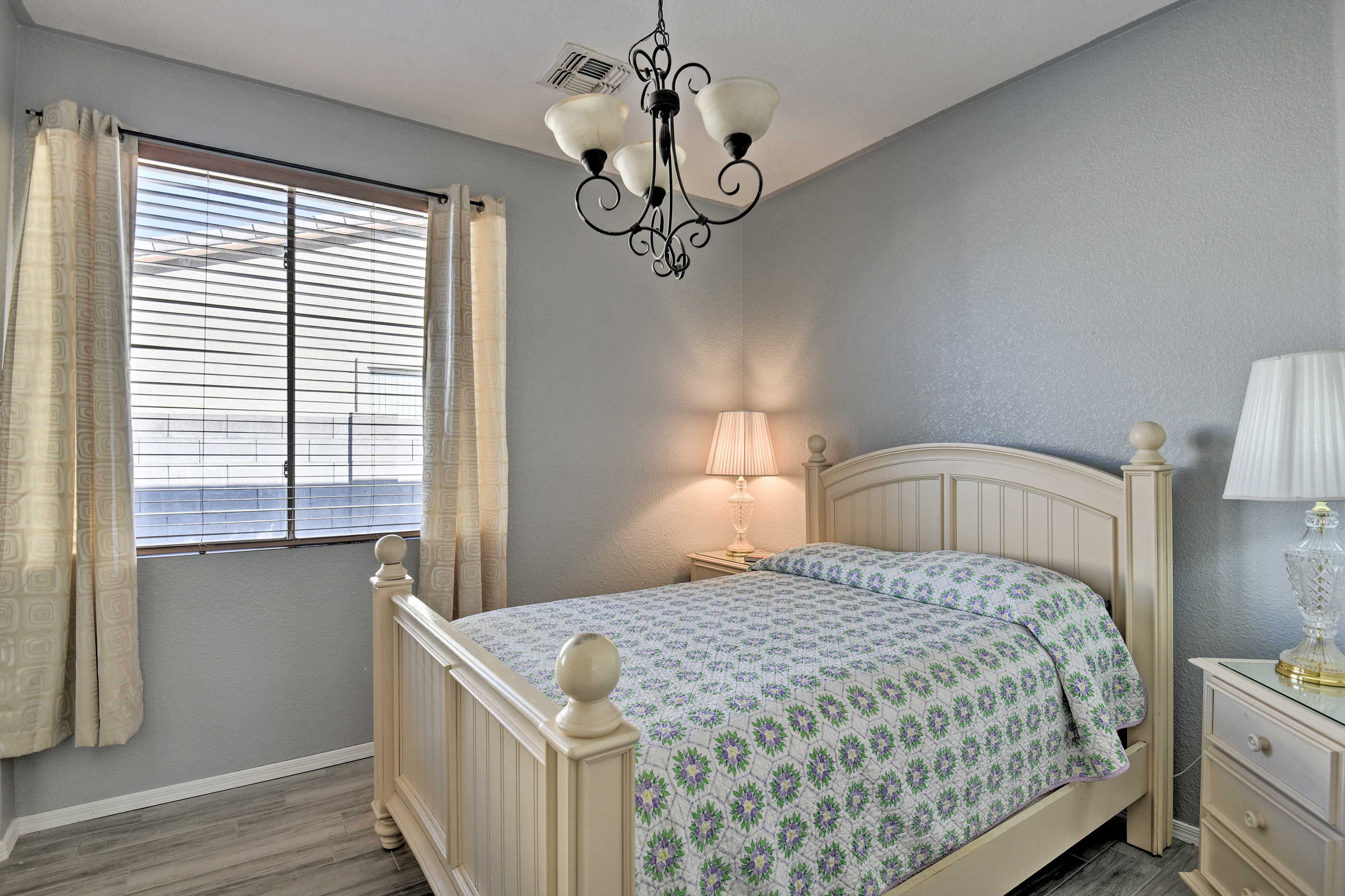 The second bedroom is equipped with a queen-sized bed.
