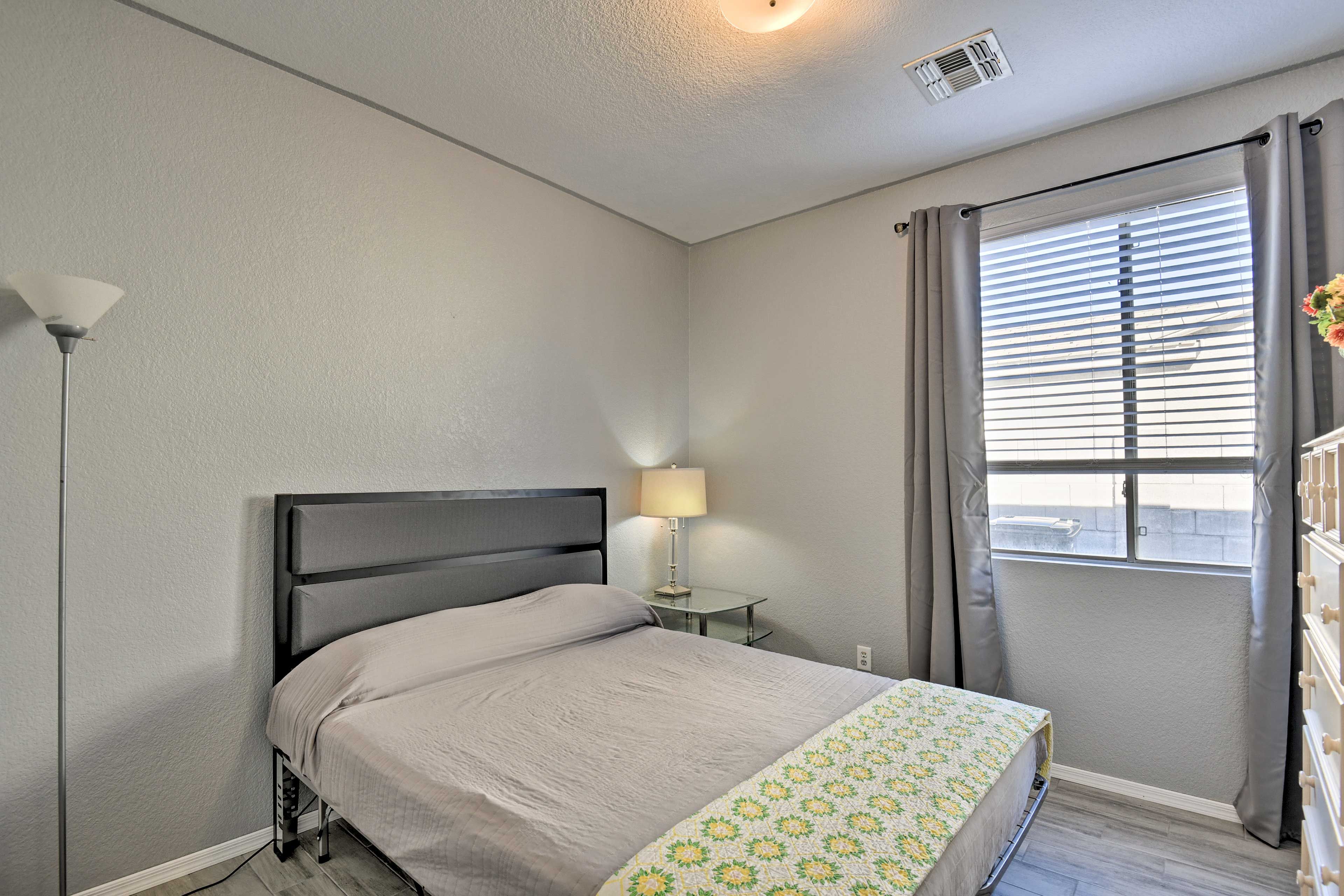 The third bedroom is complete with a full-sized bed.