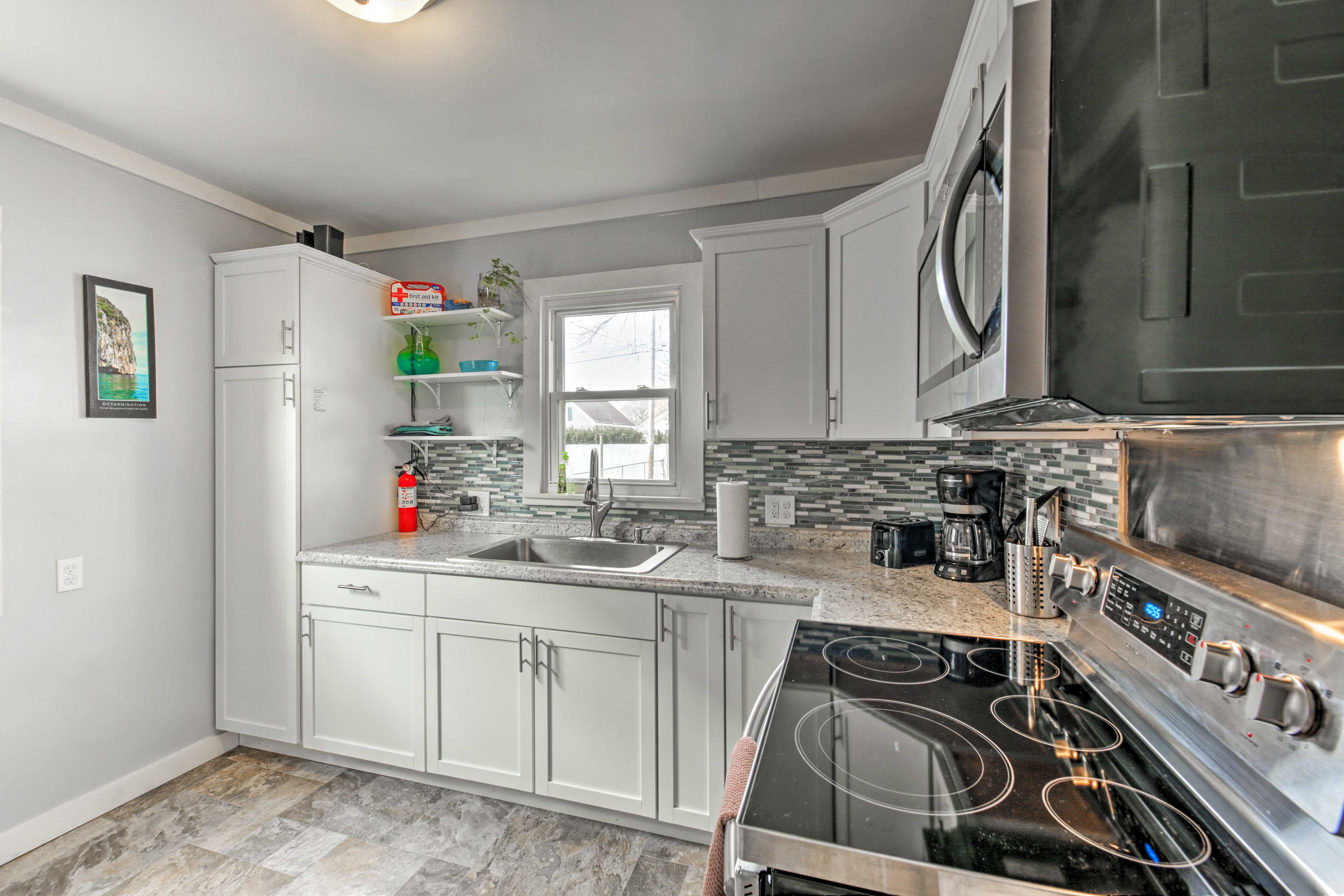 The kitchen comes fully equipped with all the cooking essentials.