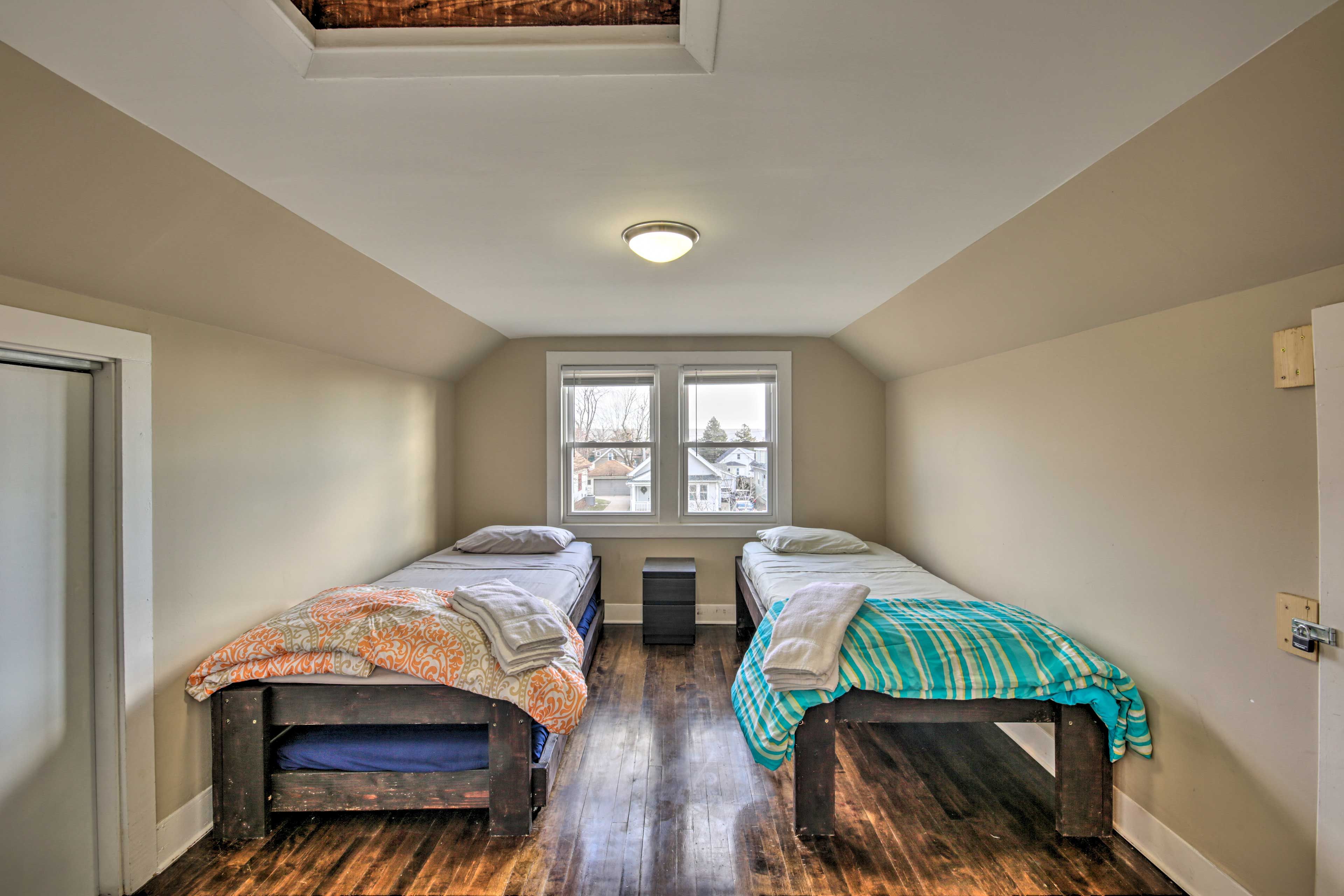 This room features 2 twin beds and a twin trundle bed.