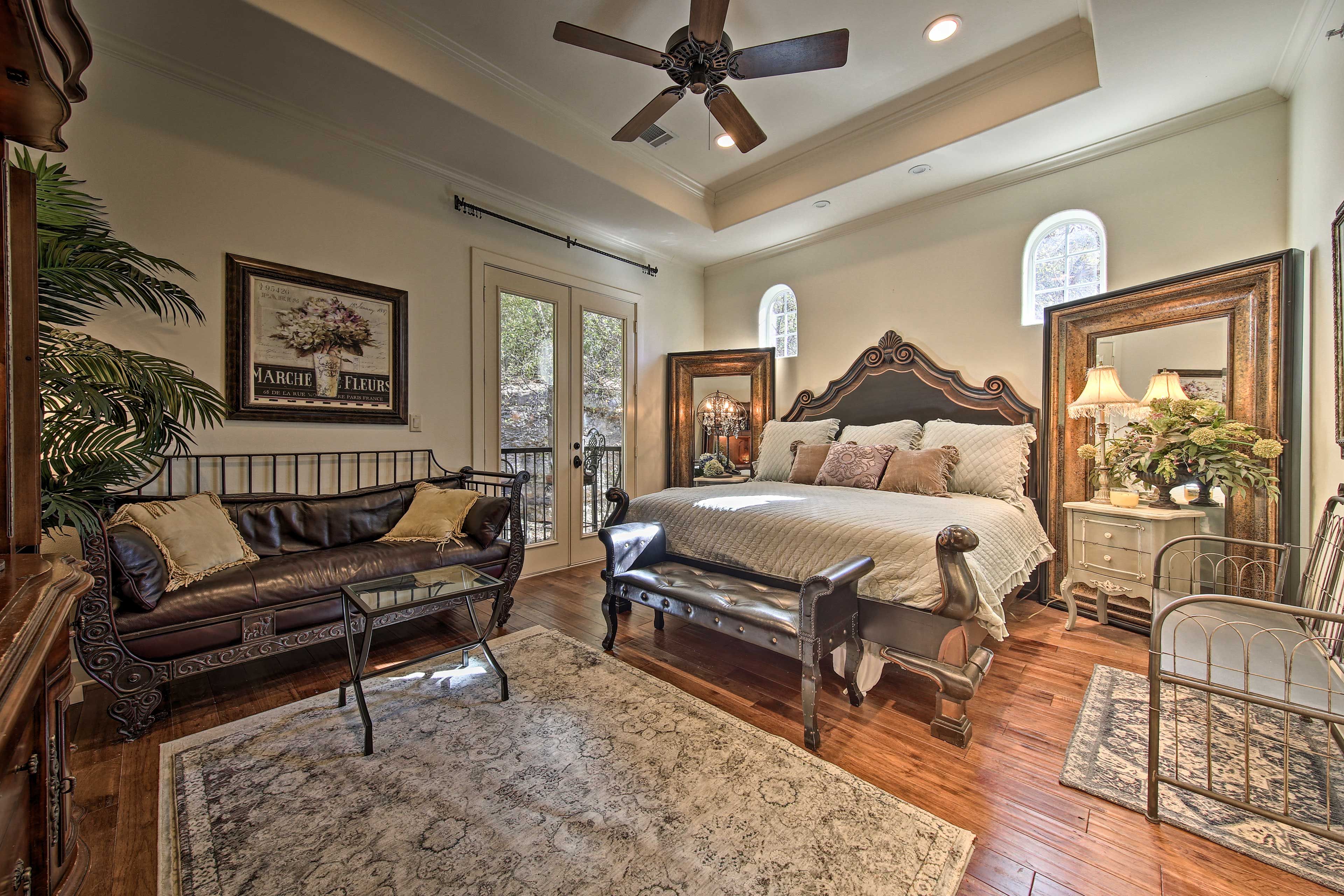 This stunning bedroom is home to a California king bed.
