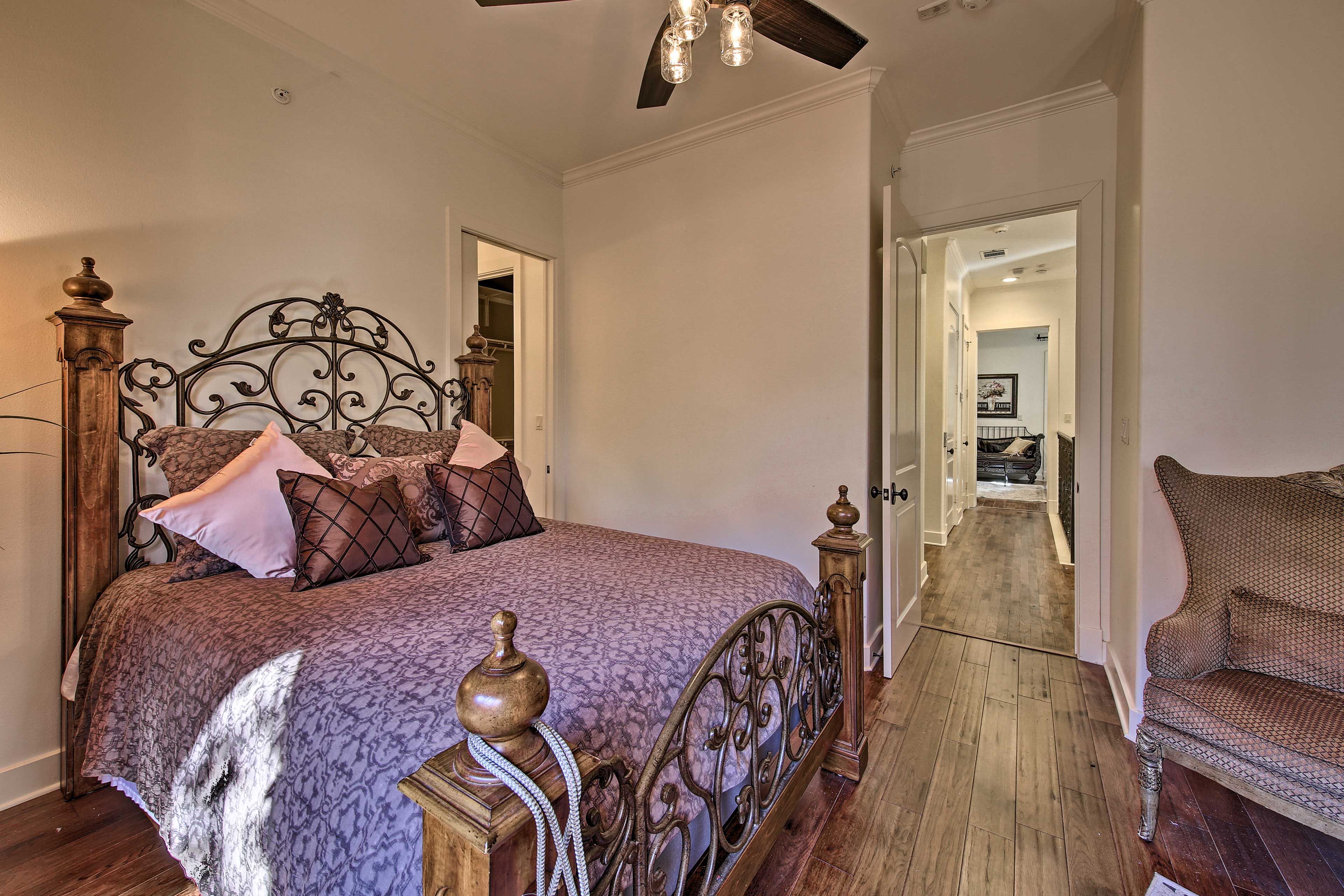 This room is home to a plush queen bed.